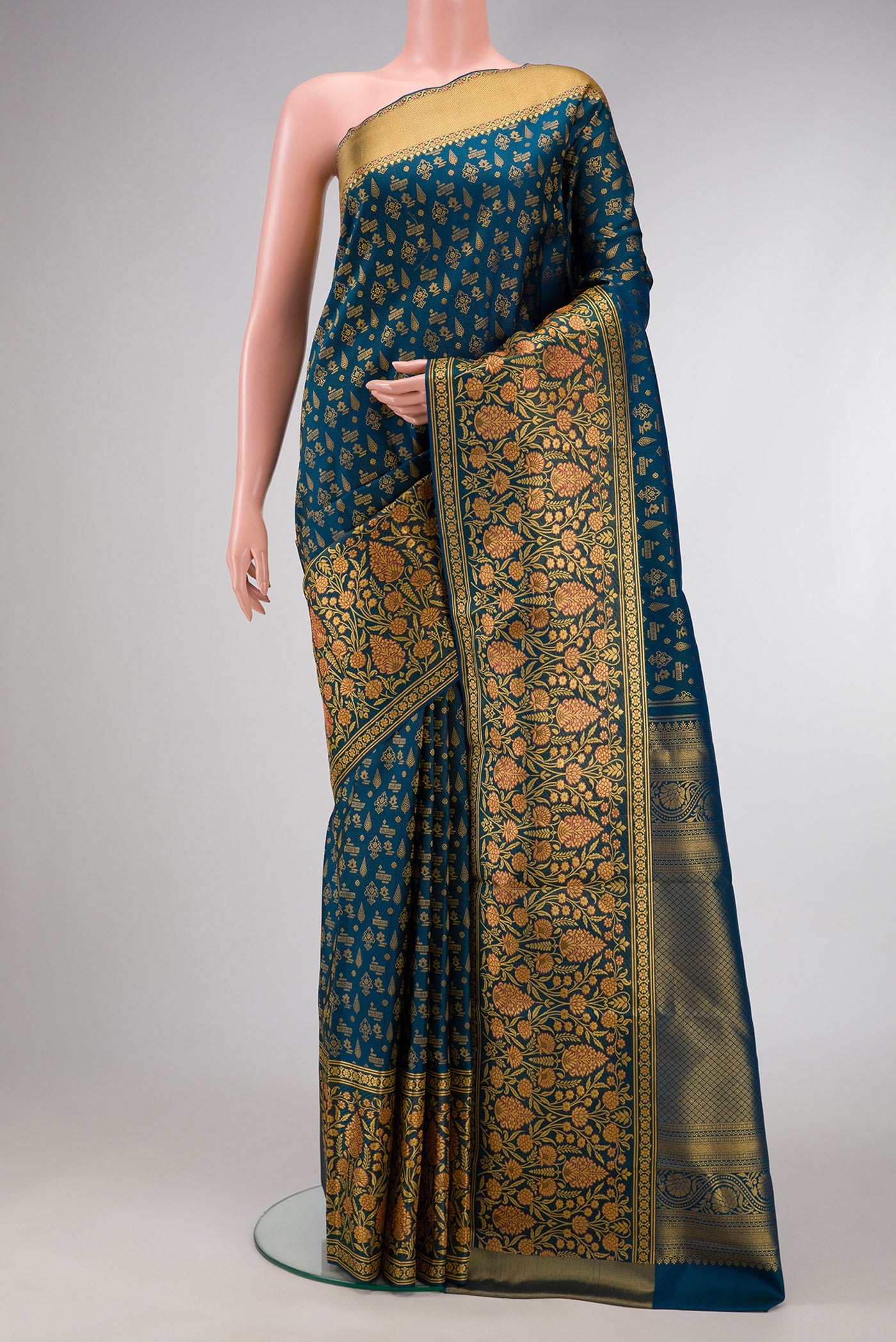 Maya Blue Dual Tone Kanjivaram Silk Saree with Zari Brocade on the body and Fancy Border.  displayed on a mannequin