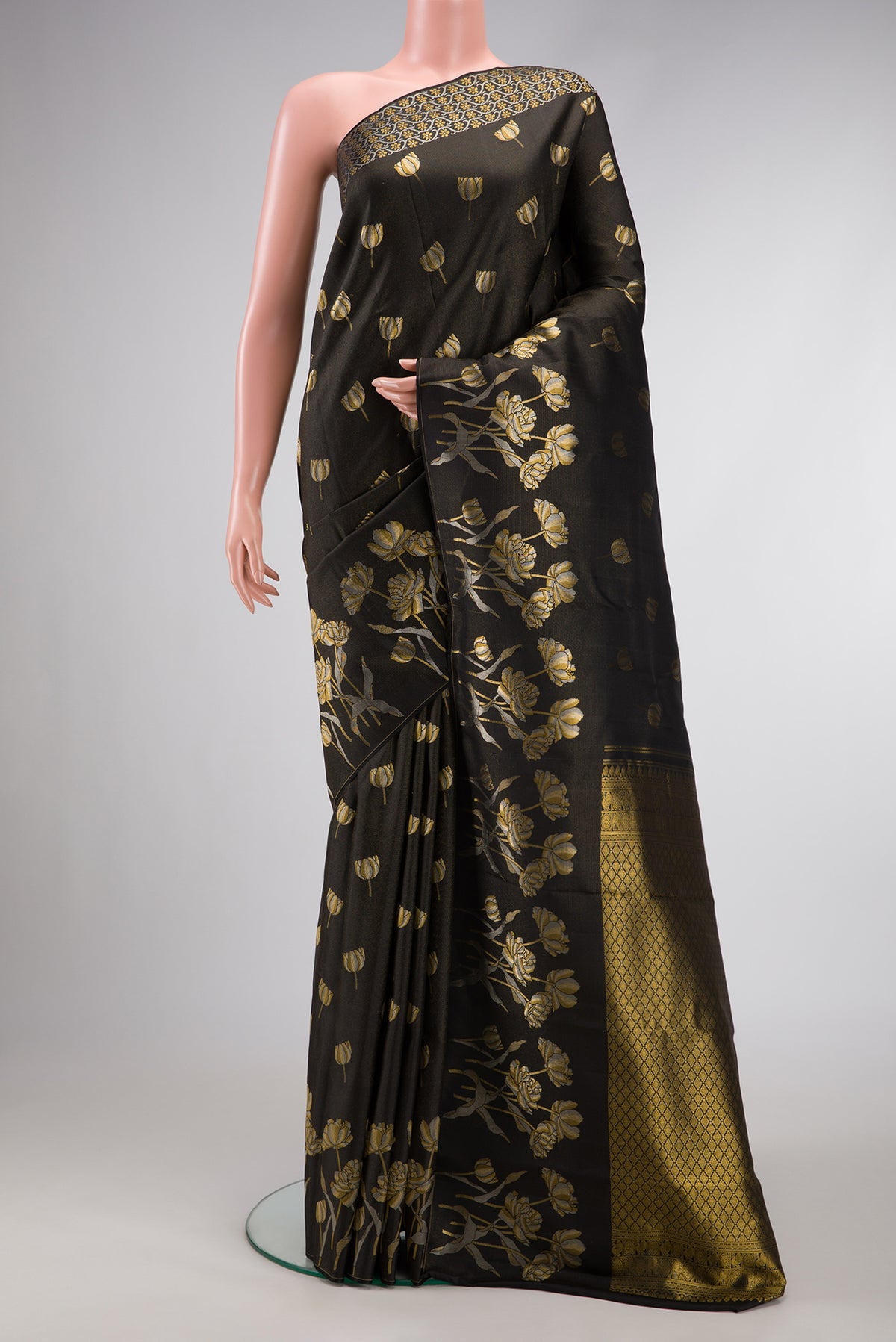 Black Dual Tone Kanjivaram Silk Saree with Zari Butta on the body and Fancy Border.  displayed on a mannequin