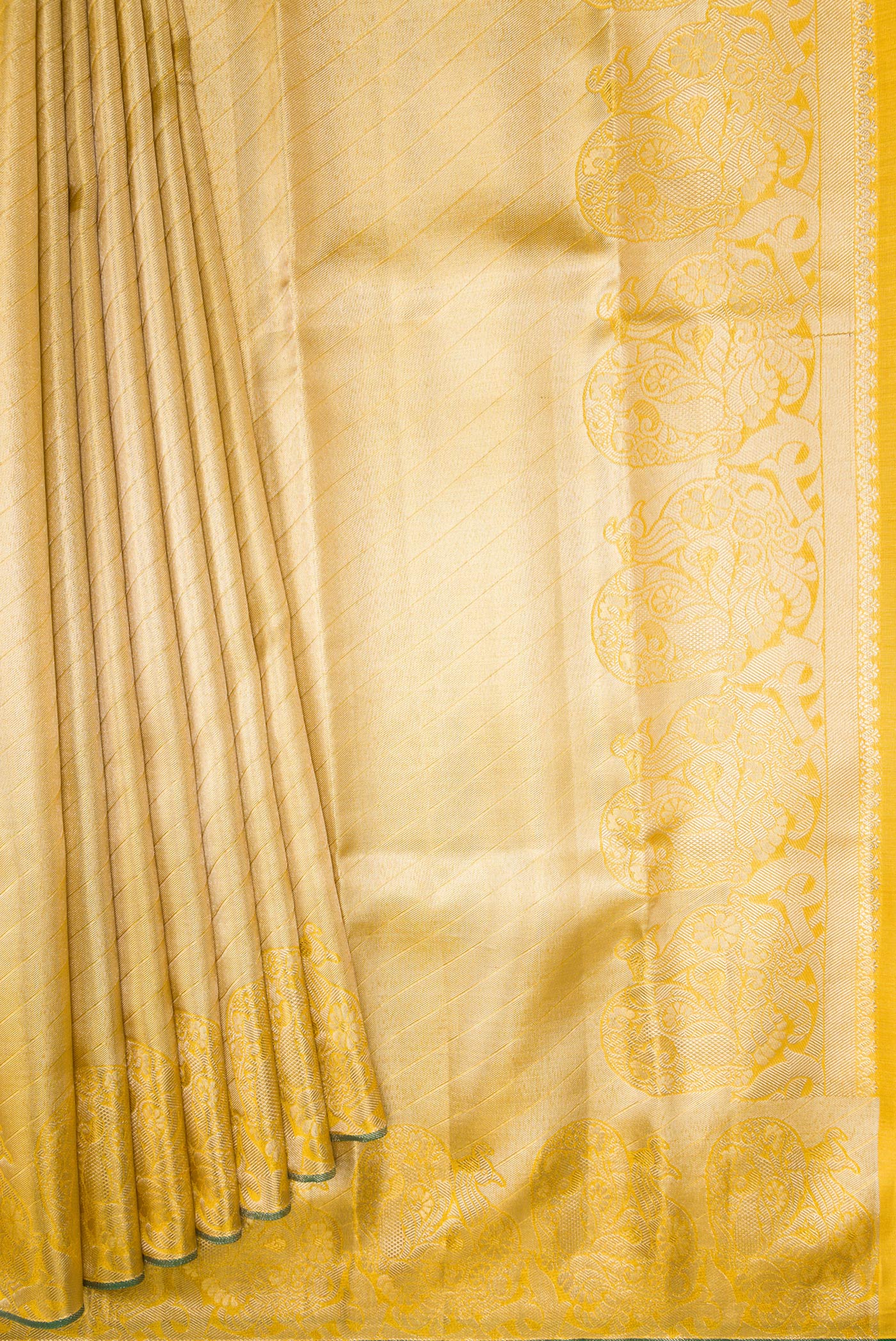 Pleats and pallu of Gold Dual Tone Kanchipuram Tissue Silk Saree with Zari Brocade on the body and Zari Border. 