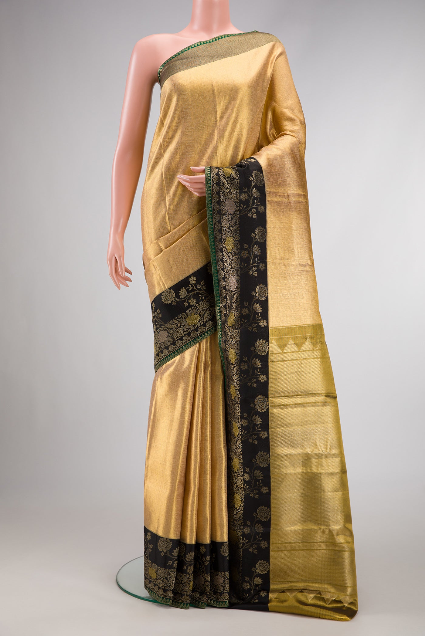 Gold Dual Tone Kanjivaram Tissue Silk Saree with Zari Brocade on the body and Fancy Border.  displayed on a mannequin