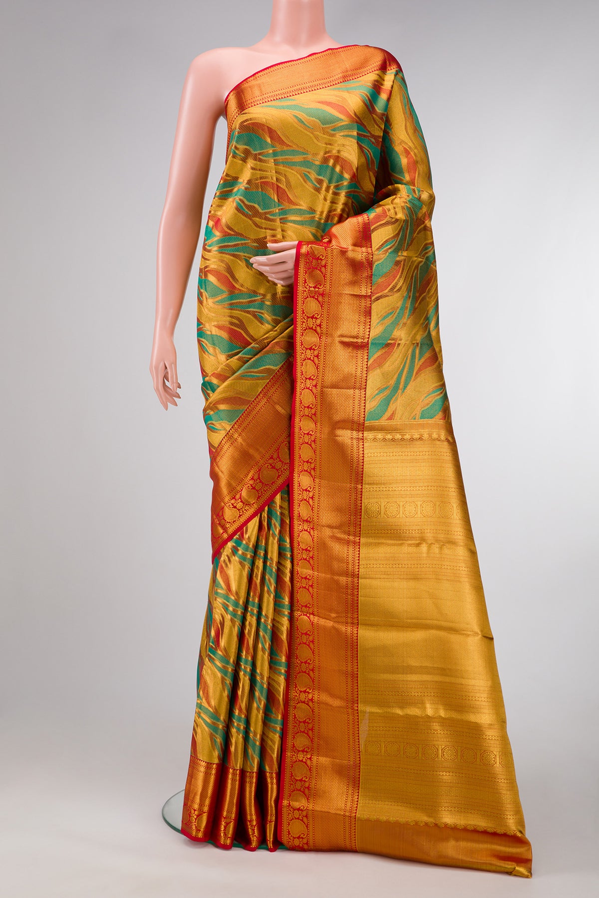 Gold Dual Tone Kanjivaram Tissue Silk Saree with Zari Brocade on the body and Zari Border.  displayed on a mannequin