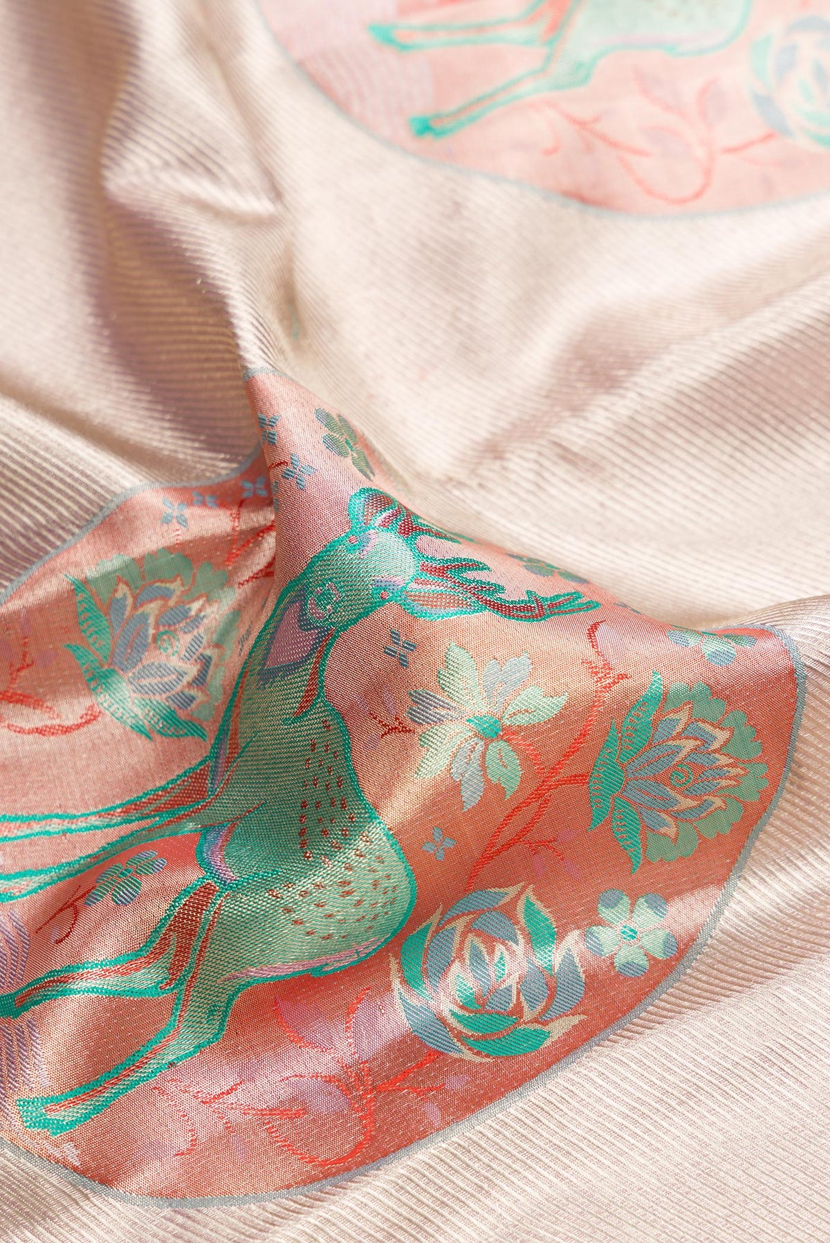 Close up of Lavender Dual Tone Kanjivaram Tissue Silk Saree with Zari Brocade on the body and Zari Border.  displaying folds