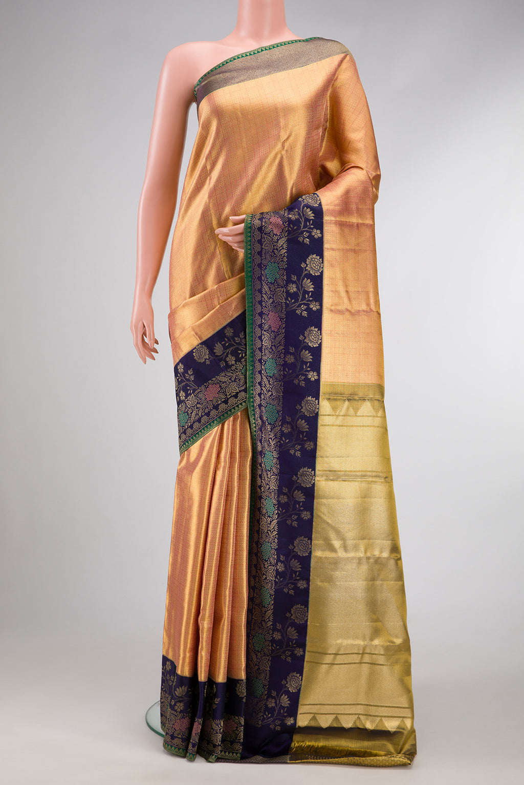 Gold Dual Tone Kanjivaram Tissue Silk Saree with Zari Brocade on the body and Fancy Border.  displayed on a mannequin