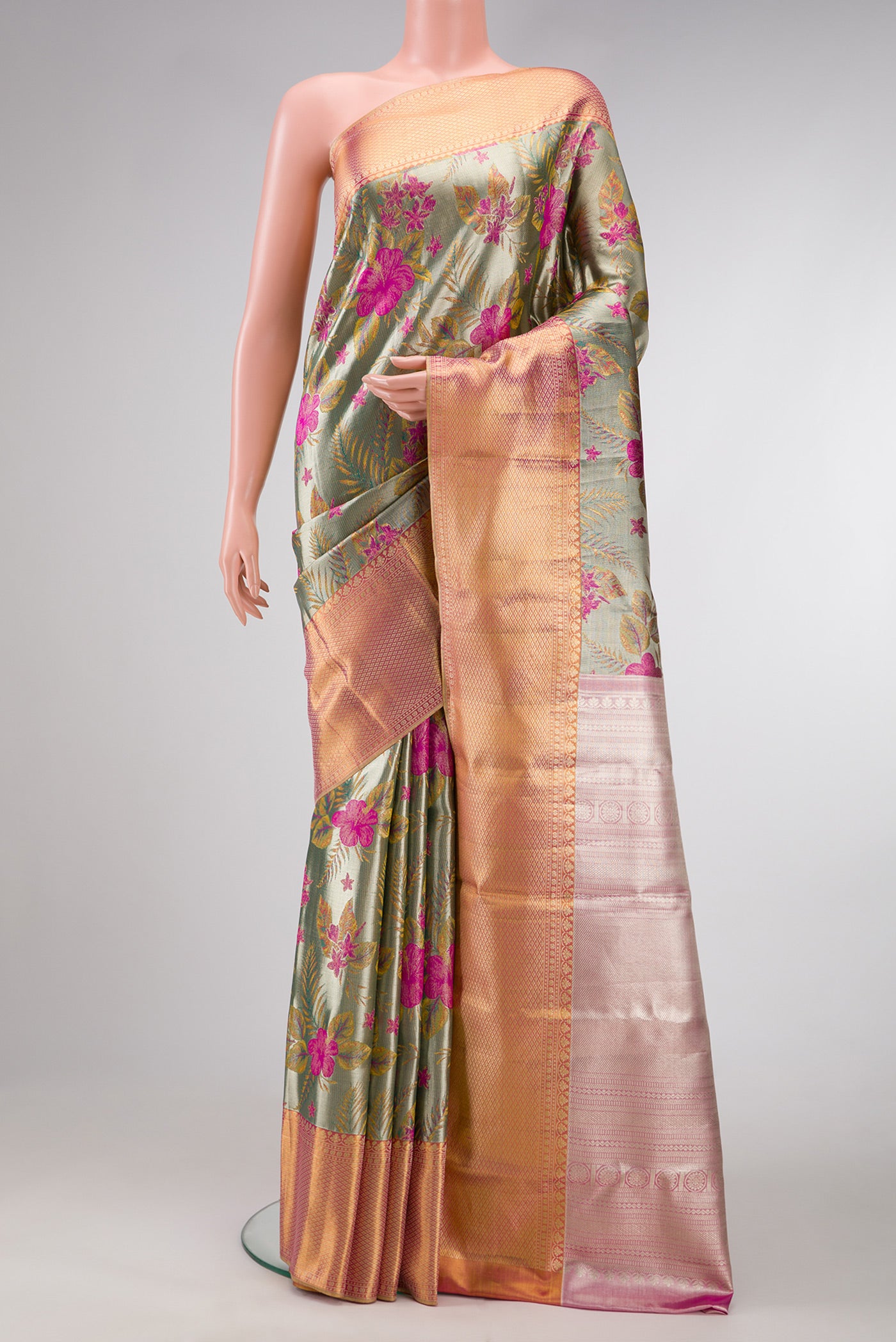 Green Dual Tone Kanjivaram Tissue Silk Saree with Zari Brocade on the body and Zari Border.  displayed on a mannequin