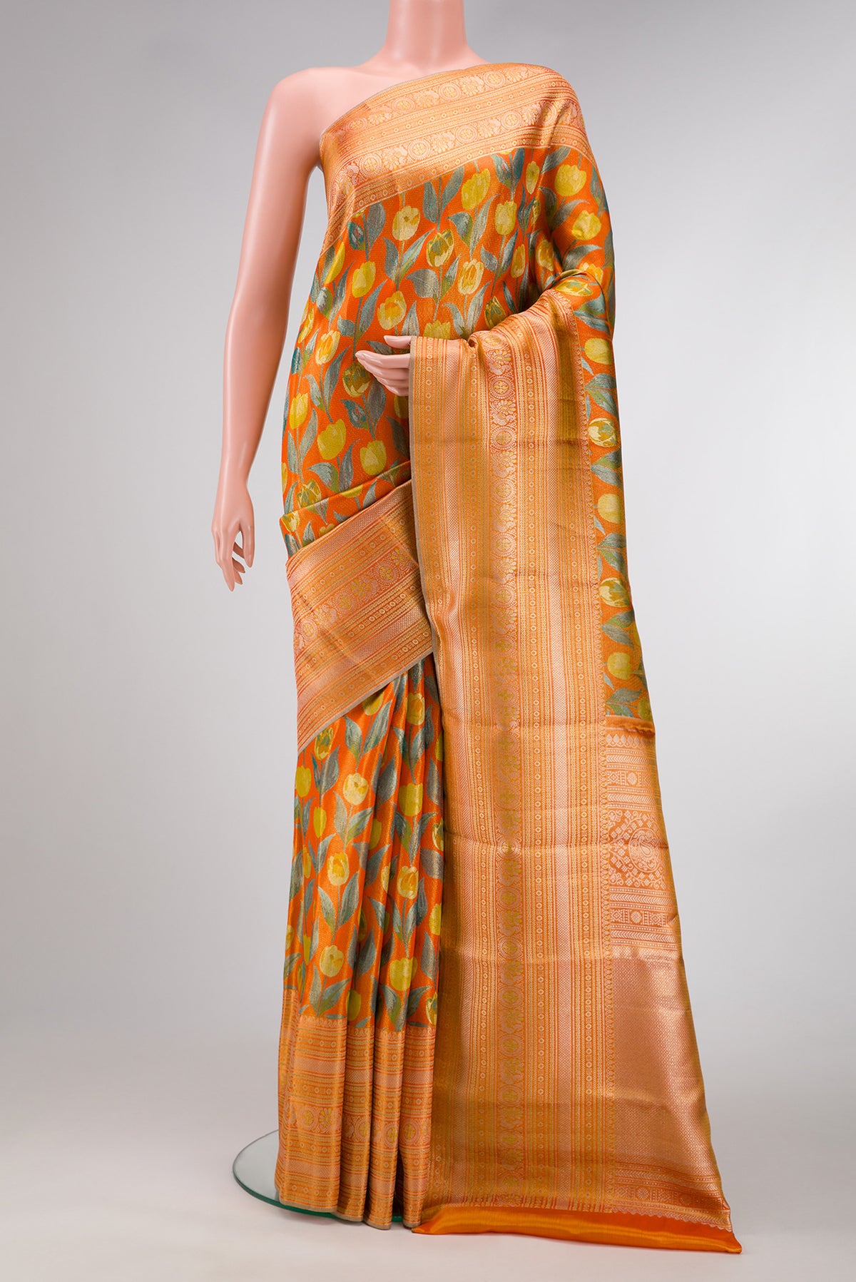 Orange Dual Tone Kanjivaram Tissue Silk Saree with Zari Brocade on the body and Zari Border.  displayed on a mannequin