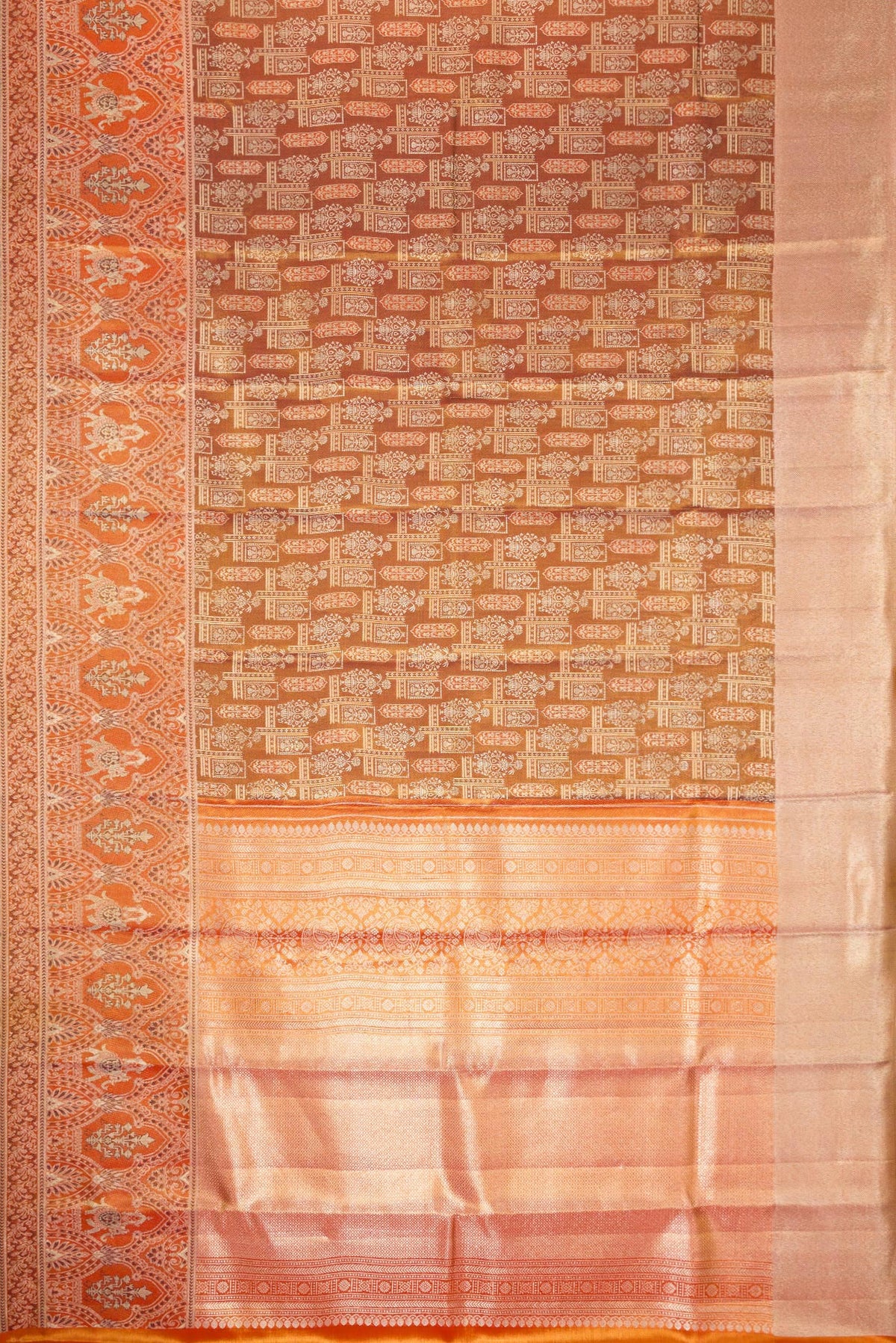 Flat view of Brown Dual Tone Kanjivaram Tissue Silk Saree with Zari Brocade on the body and Fancy Border. 
