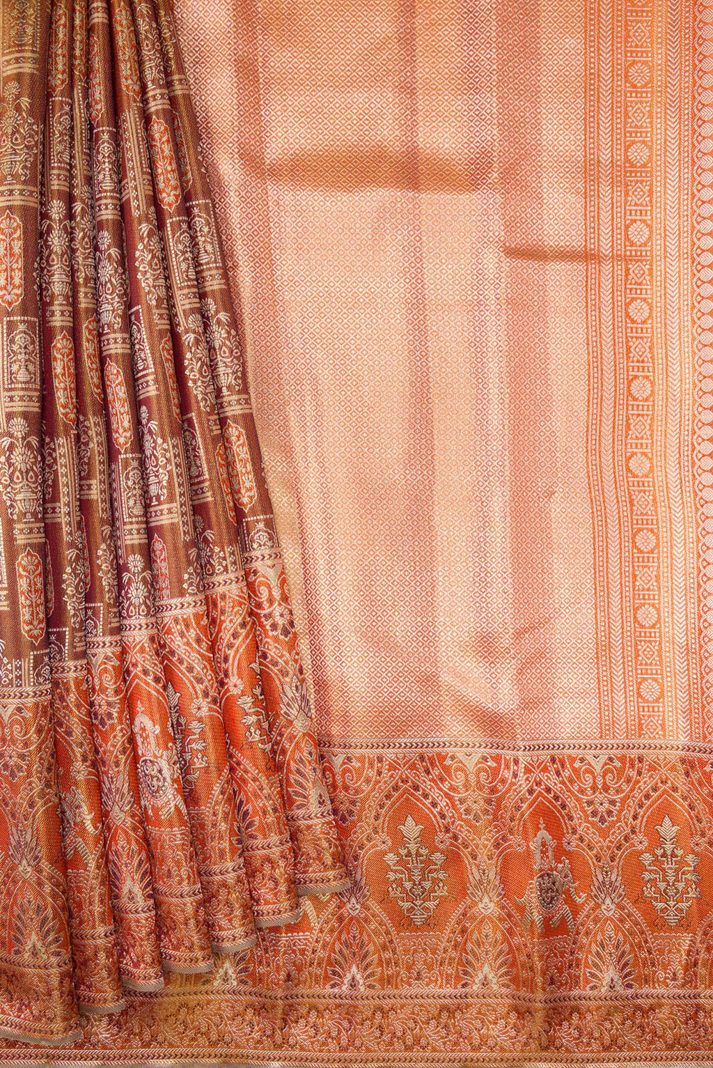Pleats and pallu of Brown Dual Tone Kanjivaram Tissue Silk Saree with Zari Brocade on the body and Fancy Border. 