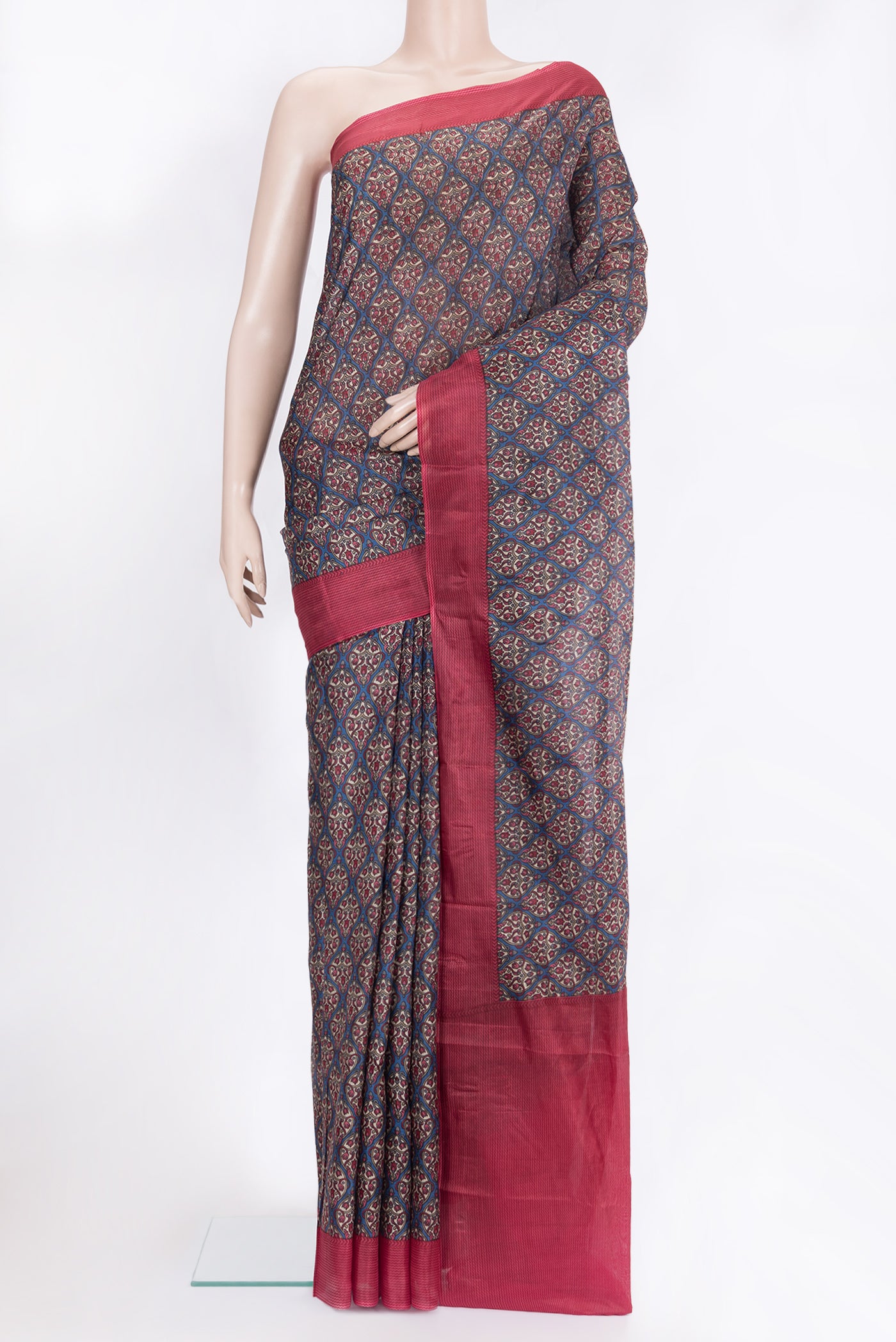 Blue Printed Silk Saree with Printed design on the body and Printed Border.  displayed on a mannequin