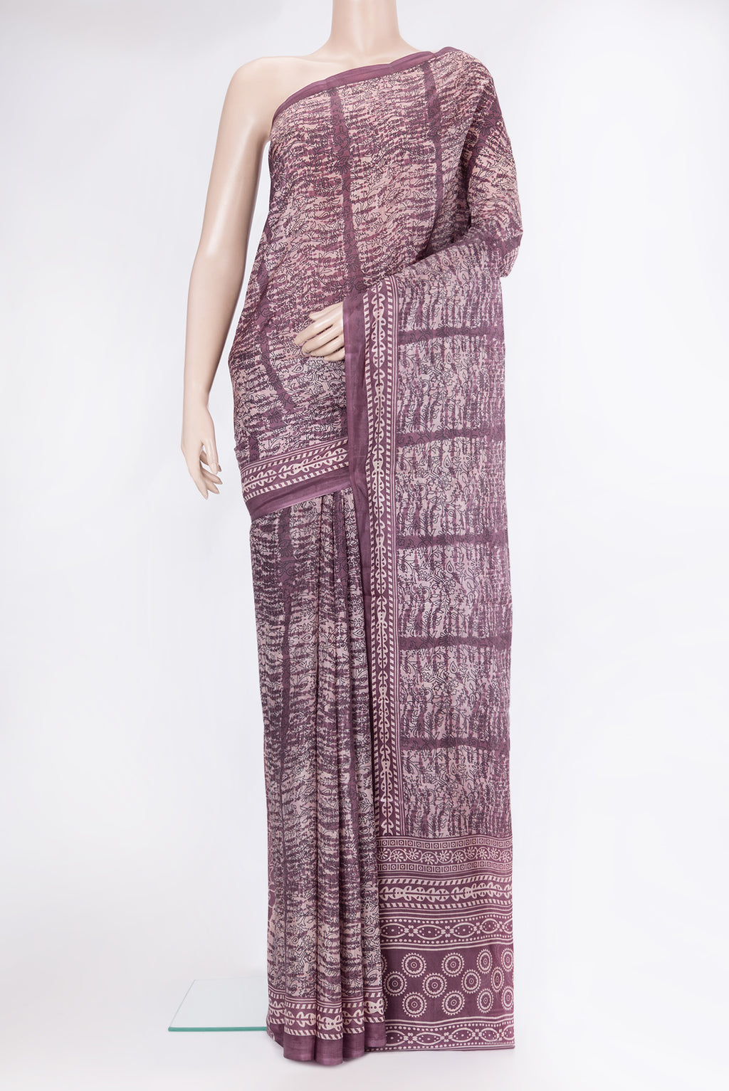 Purple Printed Silk Saree with Printed design on the body and Printed Border.  displayed on a mannequin