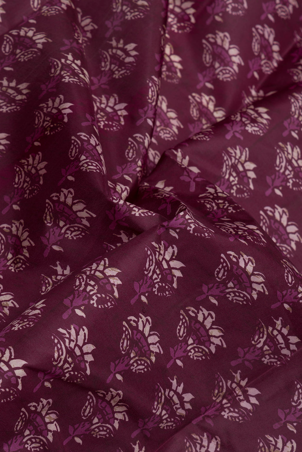 Close up of Purple Printed Silk Saree with Printed design on the body and Printed Border.  displaying folds