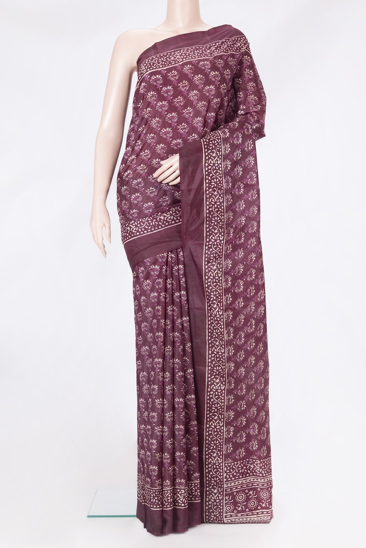 Purple Printed Silk Saree with Printed design on the body and Printed Border.  displayed on a mannequin