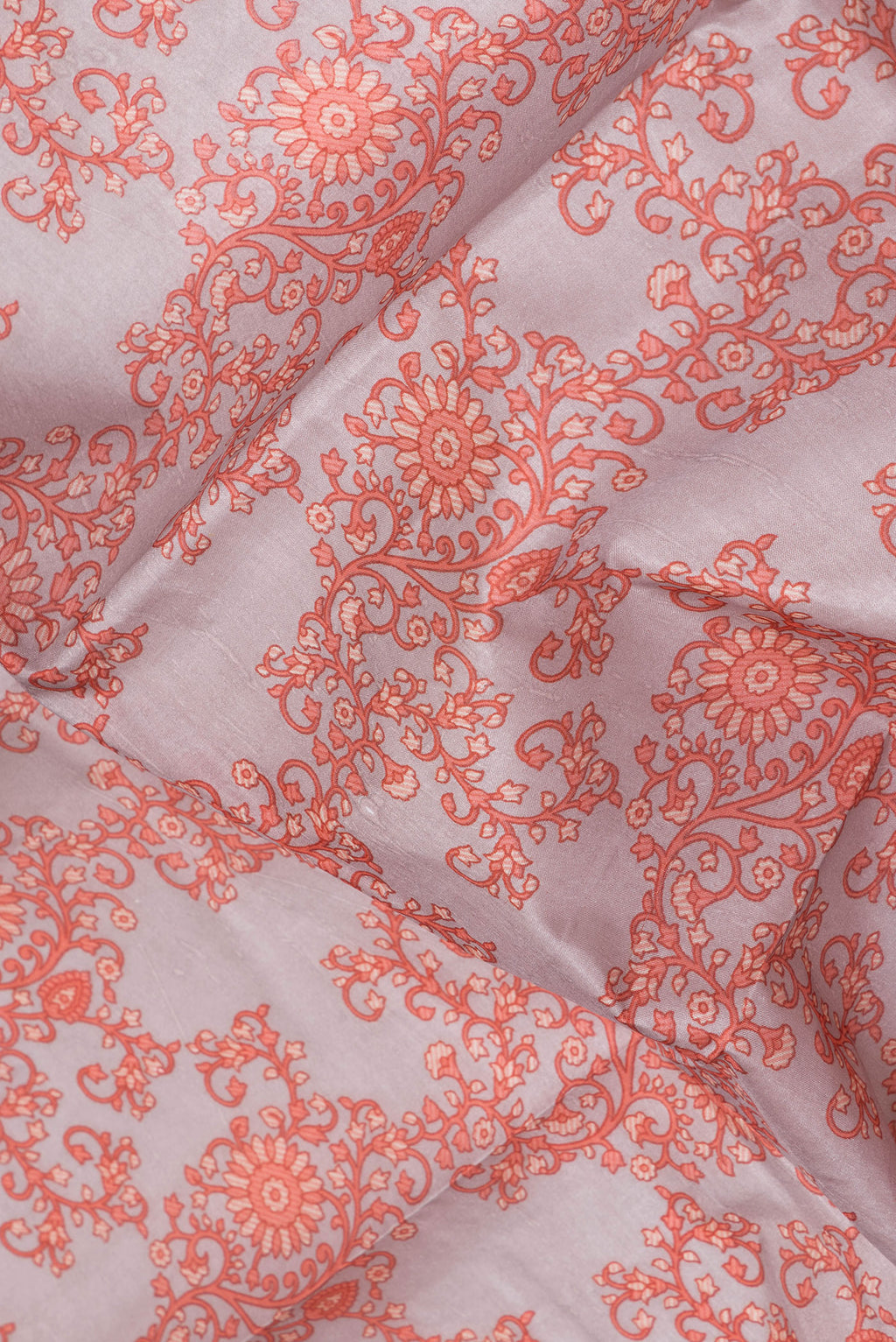 Close up of Grey Printed Silk Saree with Printed design on the body and Printed Border.  displaying folds