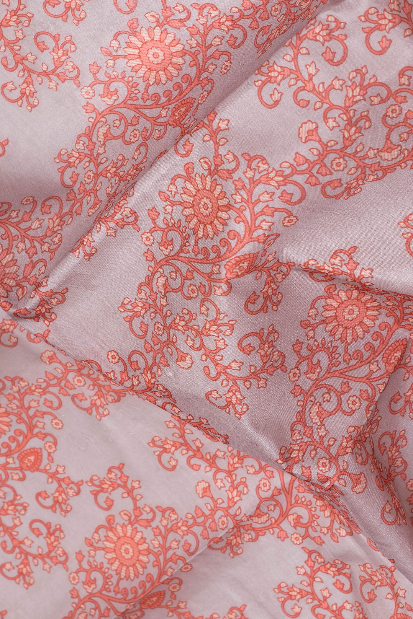 Close up of Grey Printed Silk Saree with Printed design on the body and Printed Border.  displaying folds