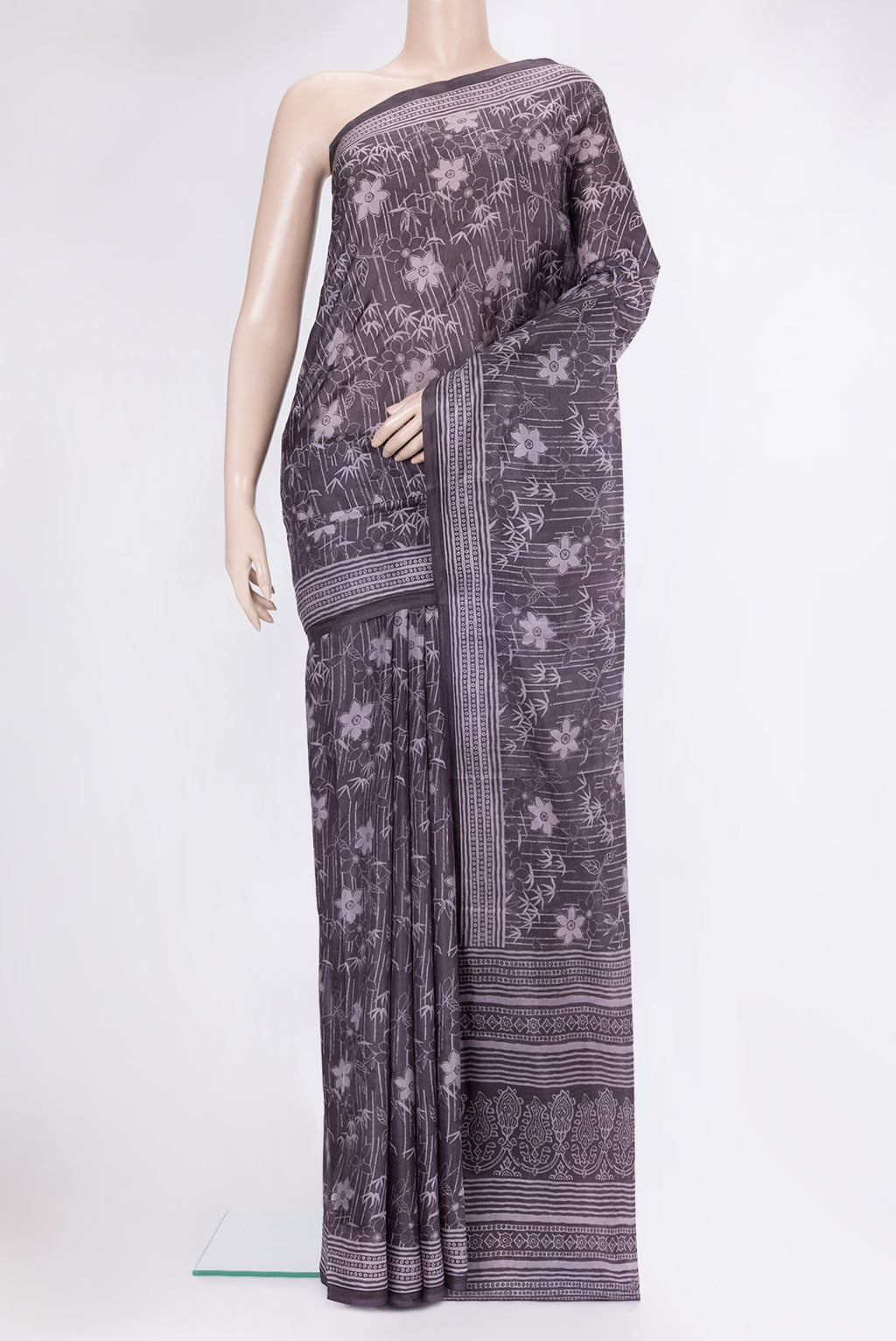 Purple Printed Silk Saree with Printed design on the body and Printed Border.  displayed on a mannequin