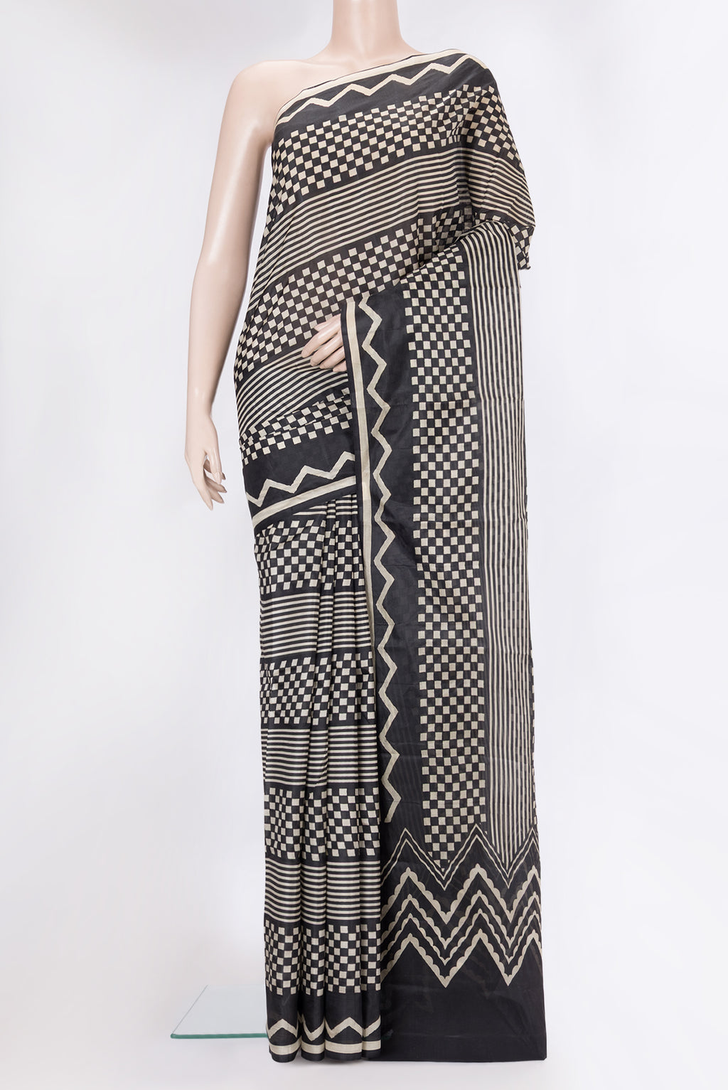Black Printed Silk Saree with Printed design on the body and Printed Border.  displayed on a mannequin