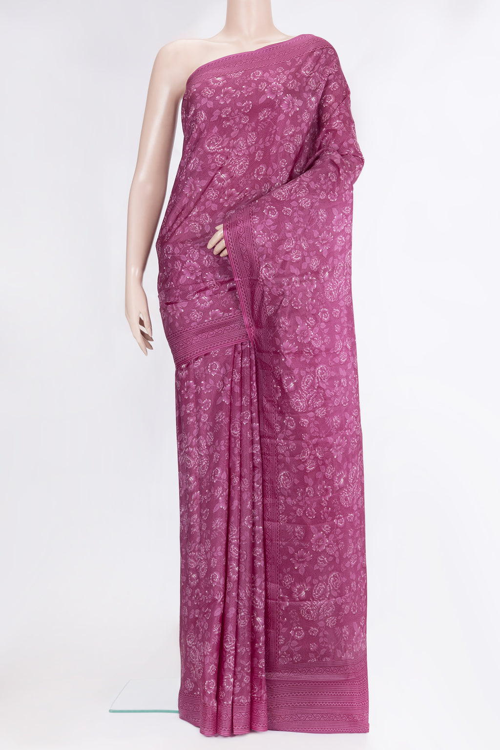Magenta Printed Silk Saree with Printed design on the body and Printed Border.  displayed on a mannequin