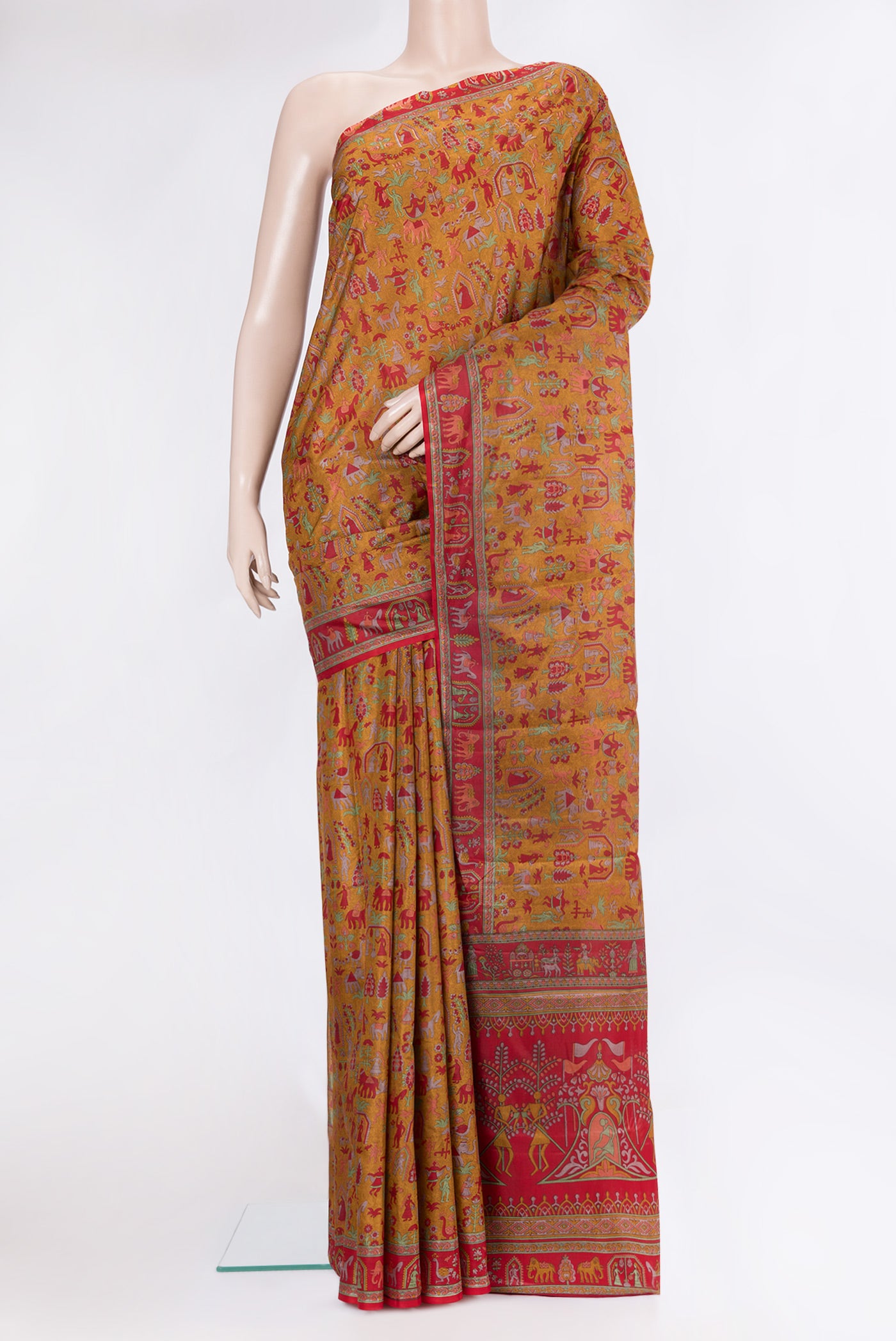 Mustard Printed Silk Saree with Printed design on the body and Printed Border.  displayed on a mannequin