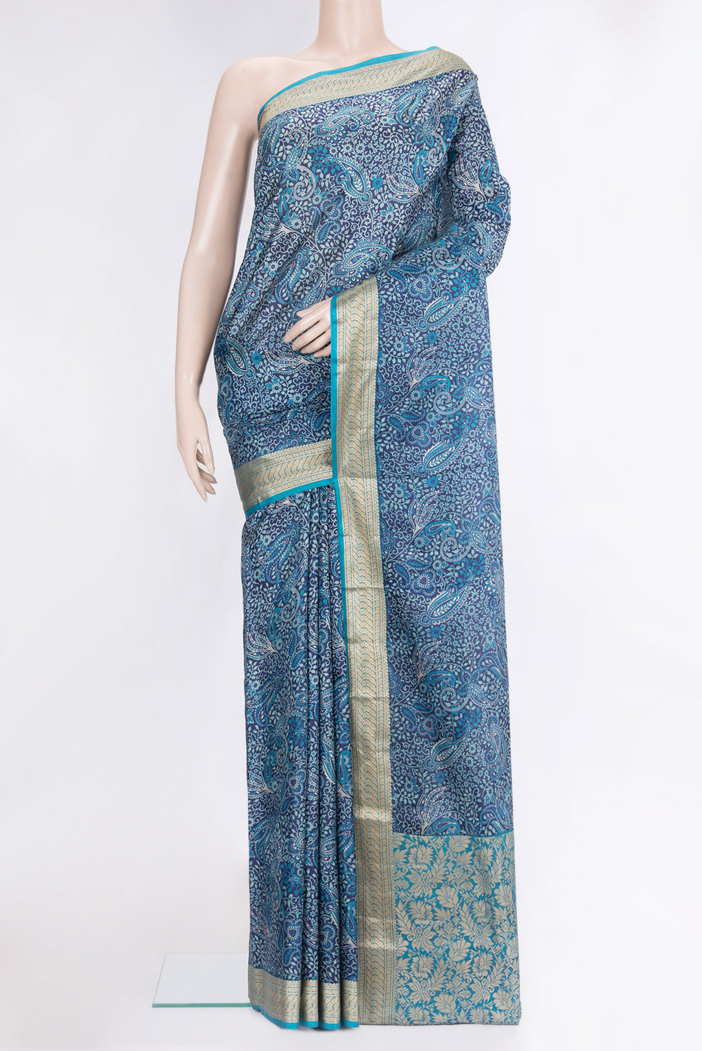 Navy Blue Printed Silk Saree with Printed design on the body and Thread Border.  displayed on a mannequin