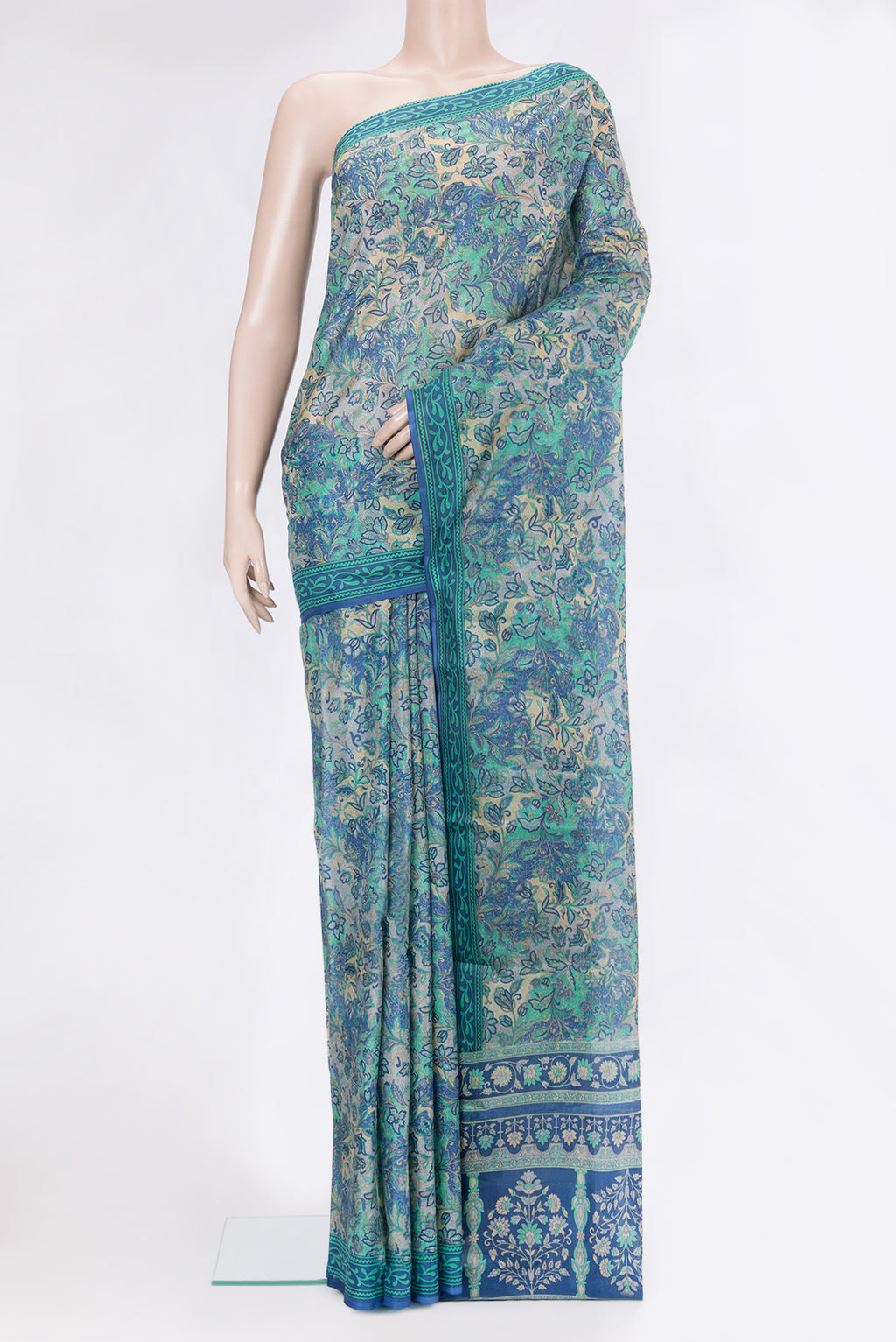 Peacock Blue Dual Tone Tussar Silk Saree with Printed design on the body and Printed Border.  displayed on a mannequin