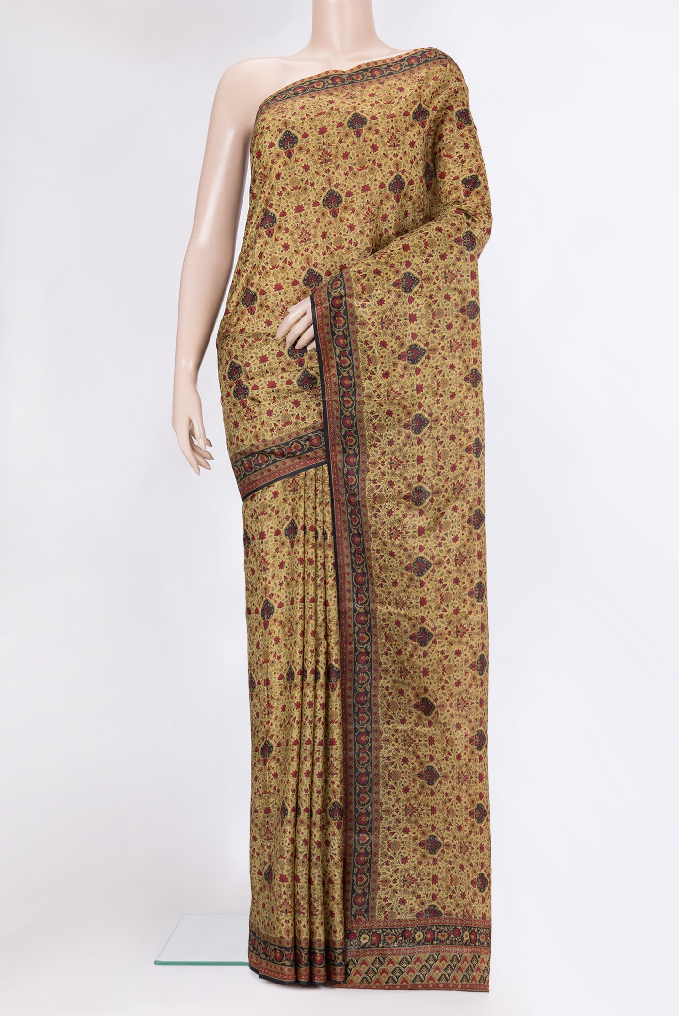 Golden Printed Silk Saree with Printed design on the body and Printed Border.  displayed on a mannequin