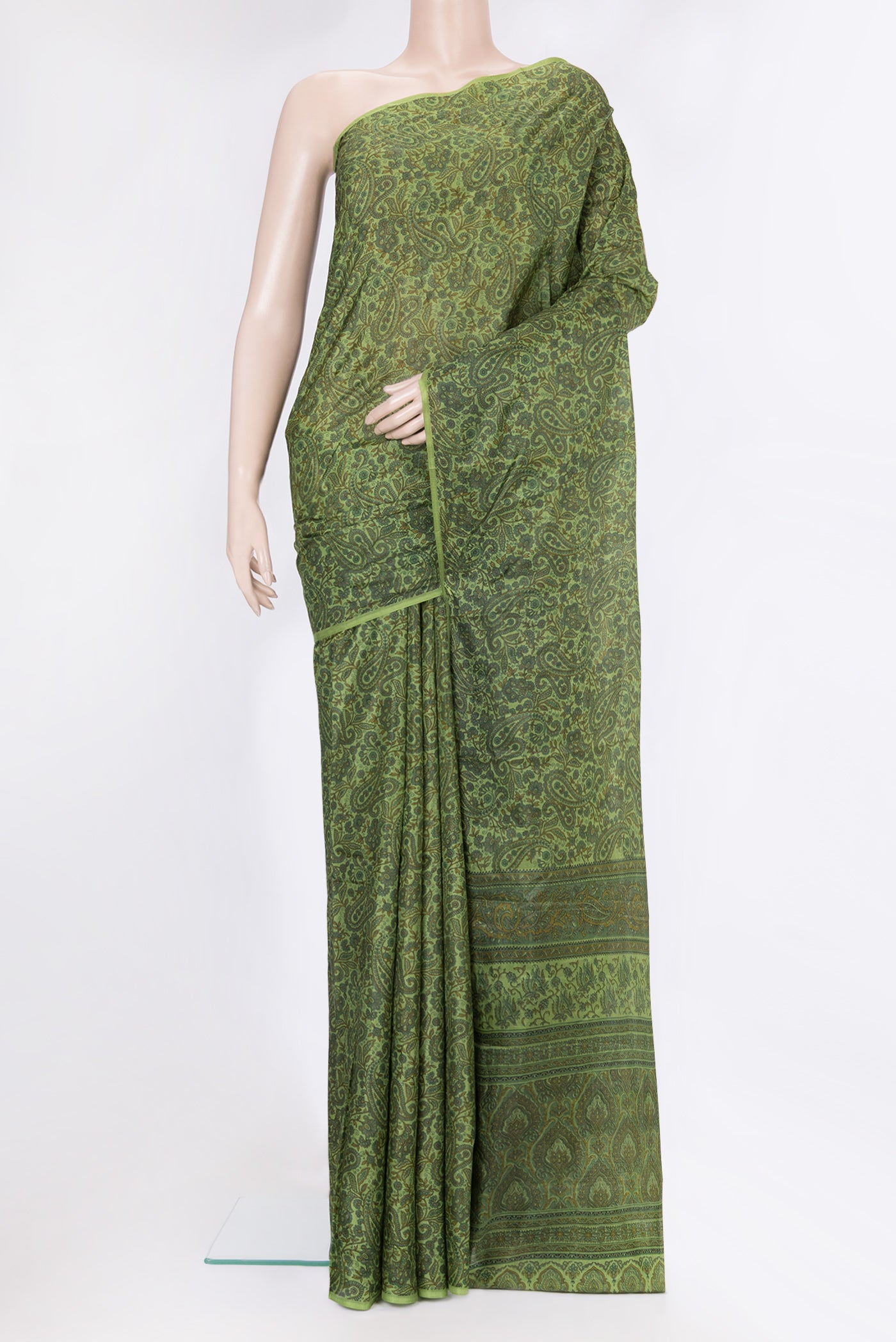 Green Printed Silk Saree with Printed design on the body and Without Border.  displayed on a mannequin