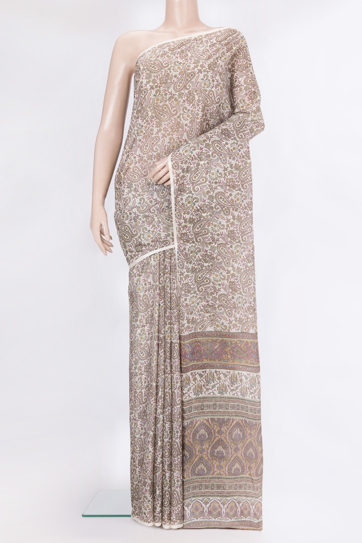 Off White Printed Silk Saree with Printed design on the body and Printed Border.  displayed on a mannequin