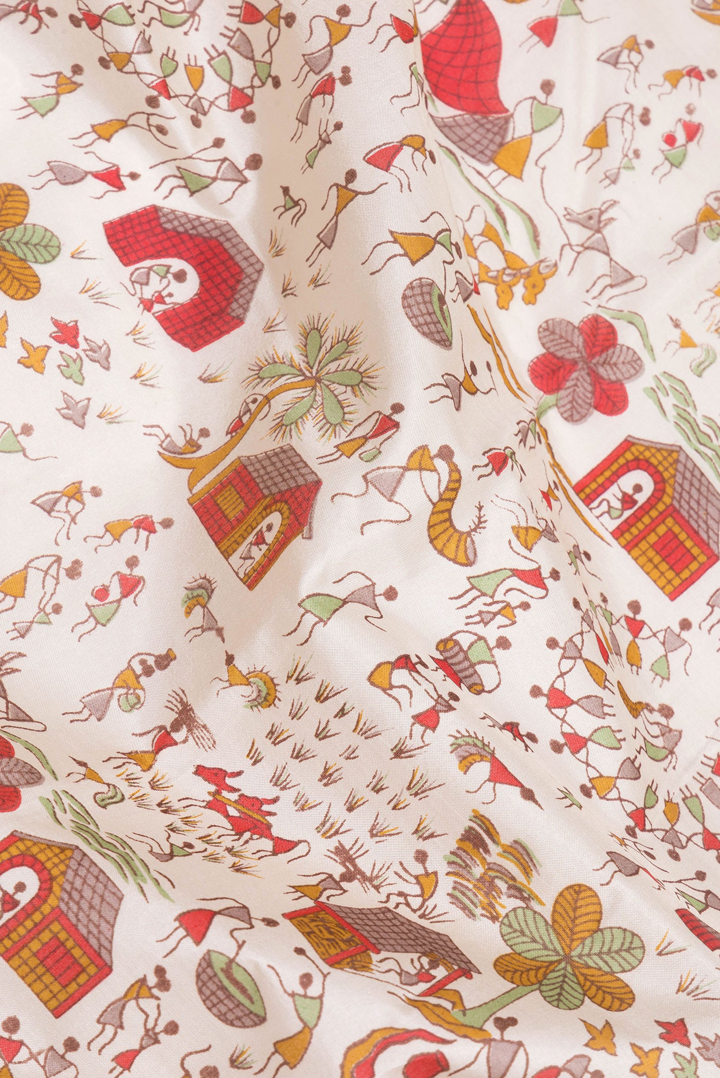 Close up of Off White Printed Silk Saree with Printed design on the body and Printed Border.  displaying folds