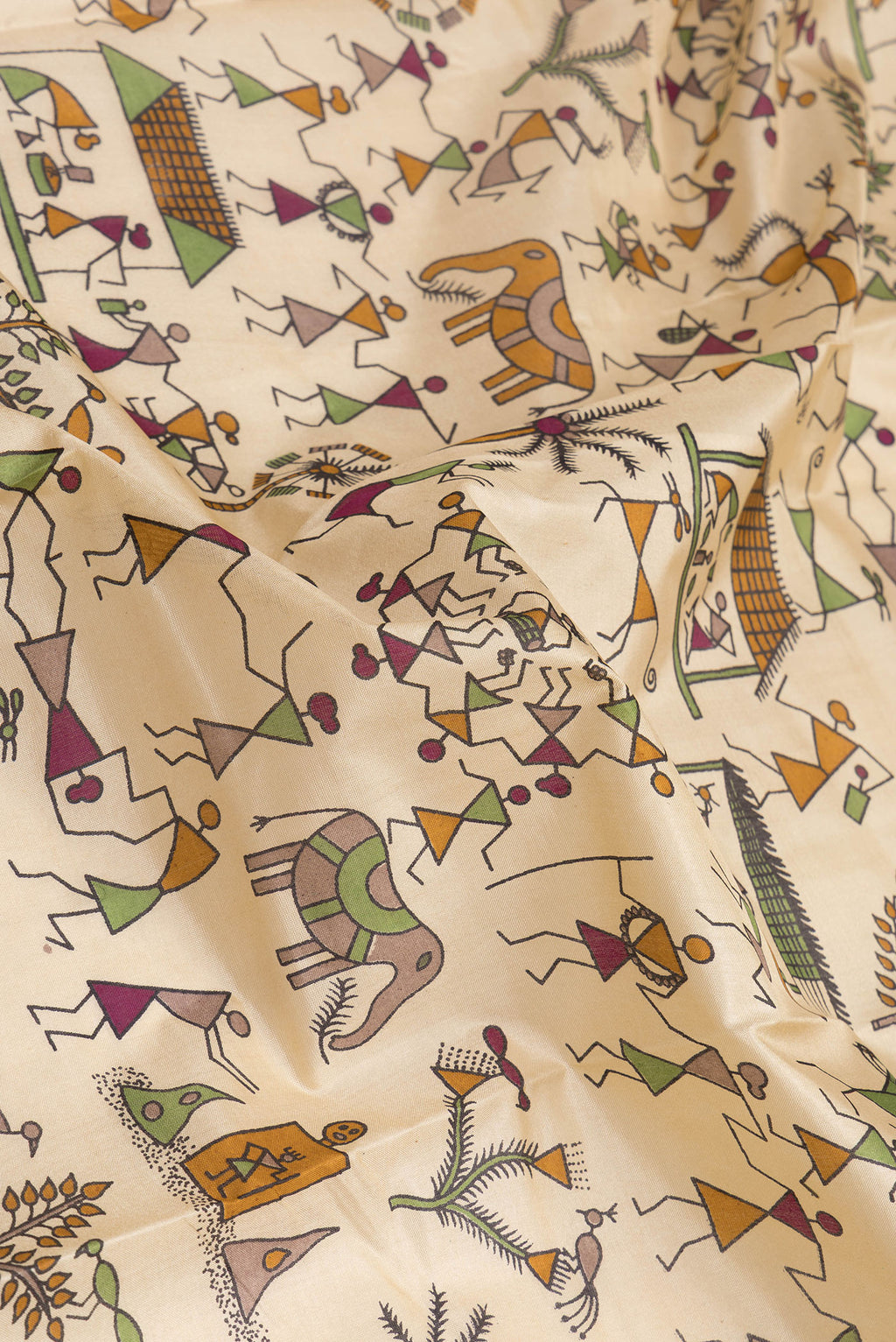 Close up of Beige Dual Tone Tussar Silk Saree with Printed design on the body and Printed Border.  displaying folds