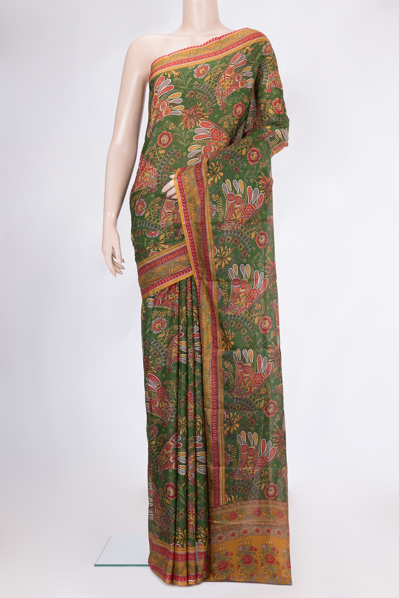 Green Printed Silk Saree with Printed design on the body and Printed Border.  displayed on a mannequin