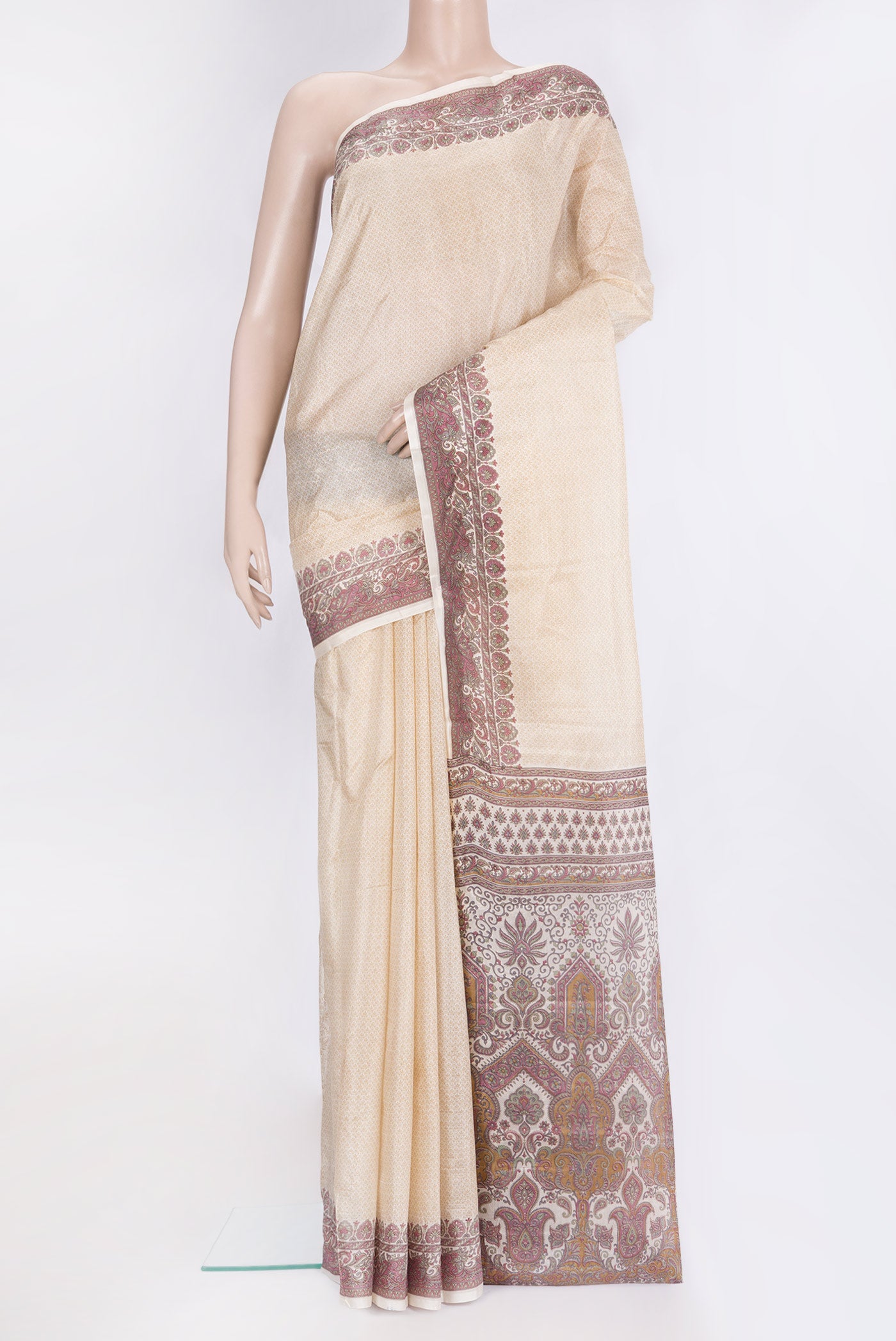 Beige Printed Silk Saree with Printed design on the body and Printed Border.  displayed on a mannequin