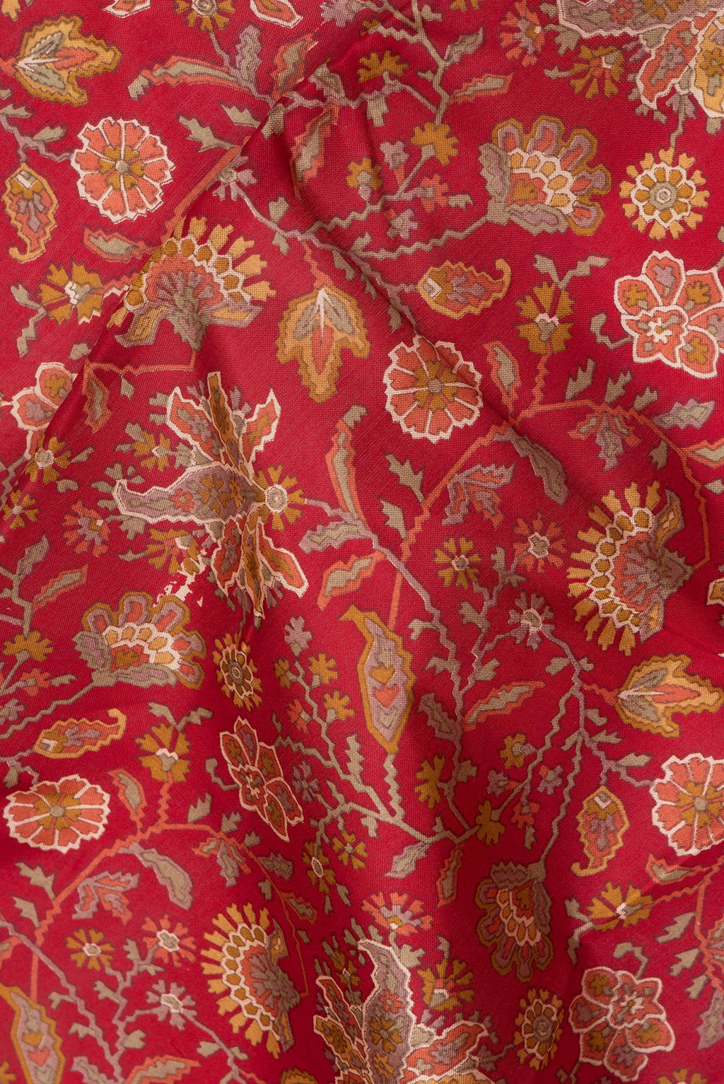 Close up of Maroon Printed Silk Saree with Printed design on the body and Printed Border.  displaying folds