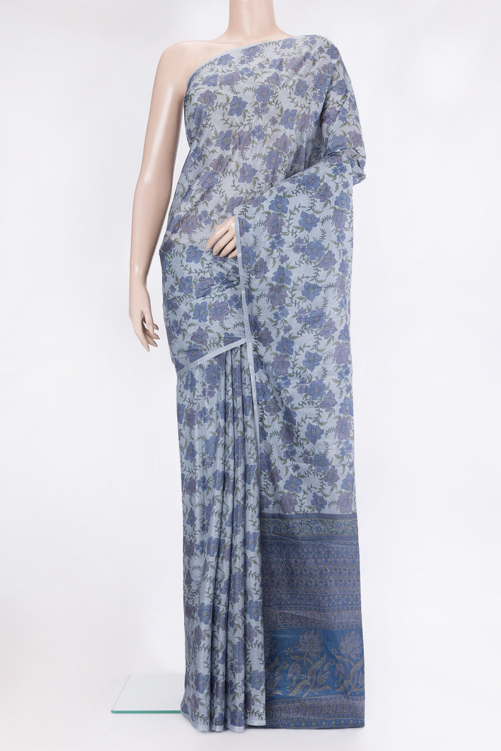 Grey Printed Silk Saree with Printed design on the body and Without Border.  displayed on a mannequin
