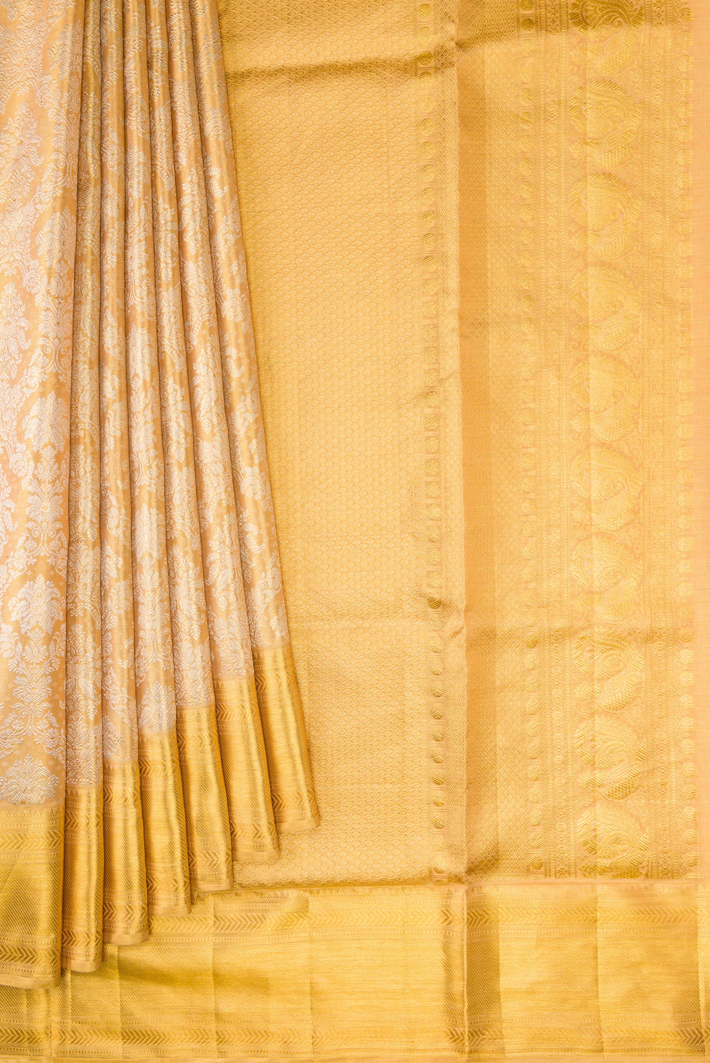 Pleats and pallu of Gold Dual Tone Kanjivaram Tissue Silk Saree with Zari Brocade on the body and Zari Border. 