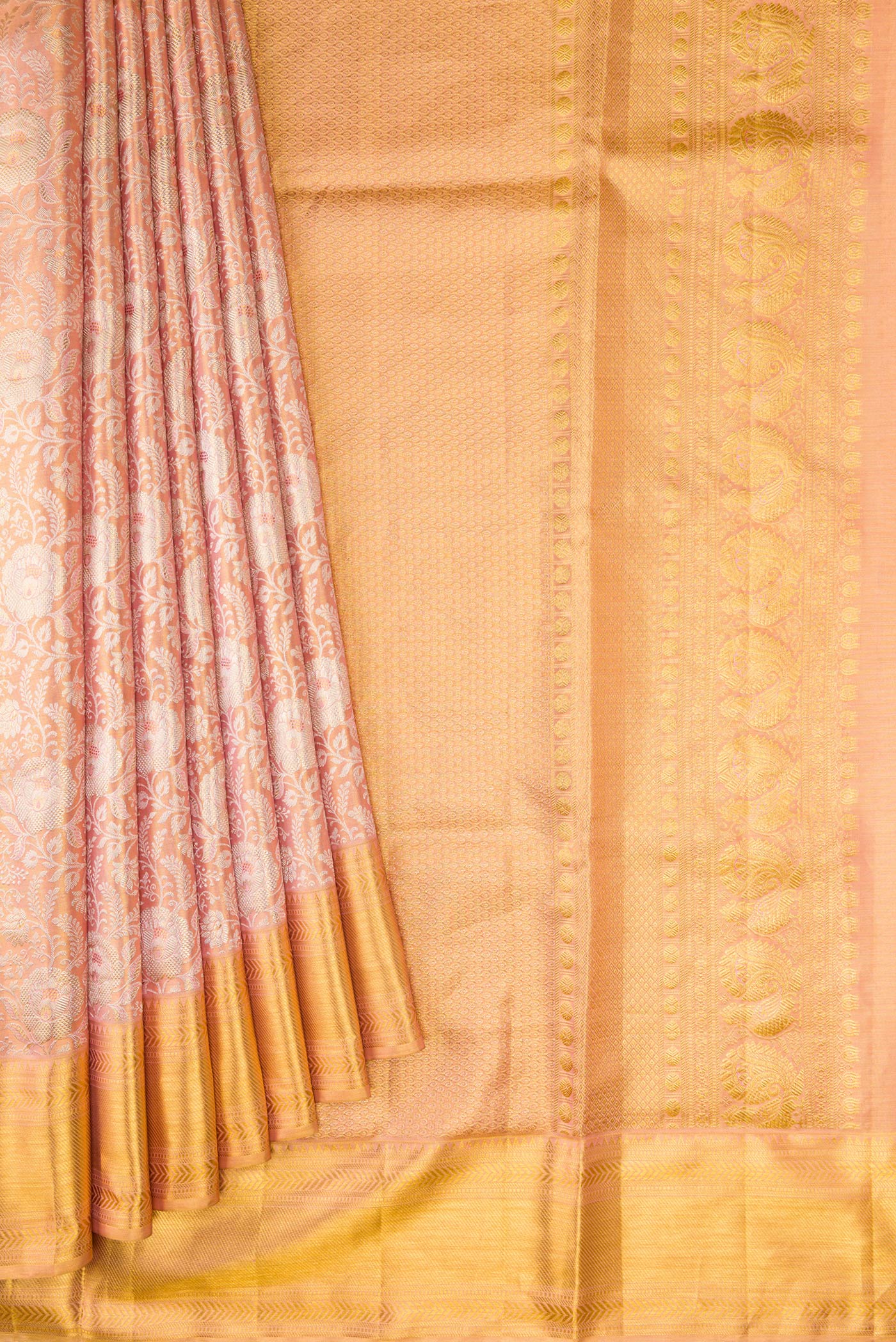 Pleats and pallu of Rose Gold Dual Tone Kanjivaram Tissue Silk Saree with Zari Brocade on the body and Zari Border. 