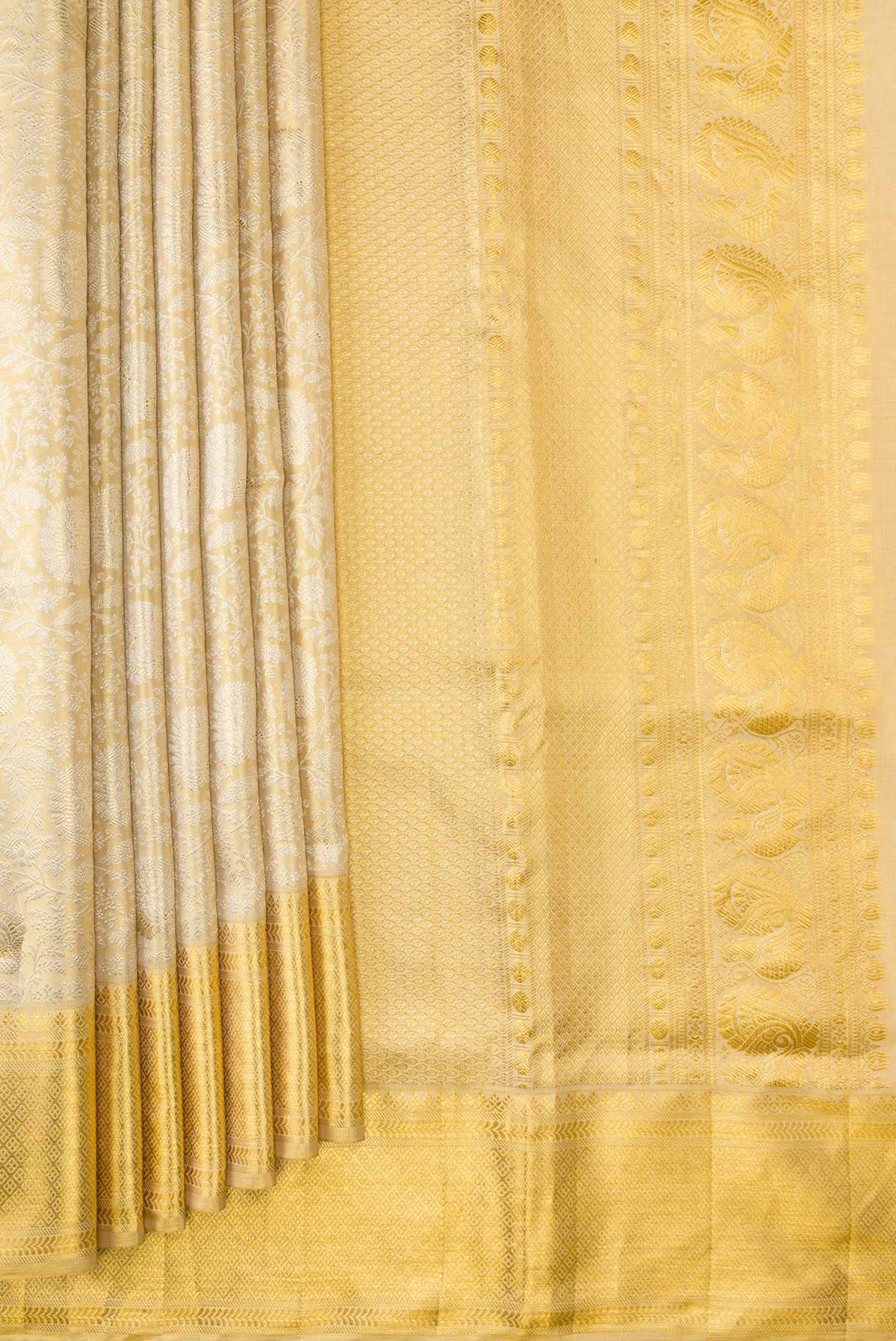 Pleats and pallu of Gold Dual Tone Kanjivaram Tissue Silk Saree with Zari Brocade on the body and Zari Border. 