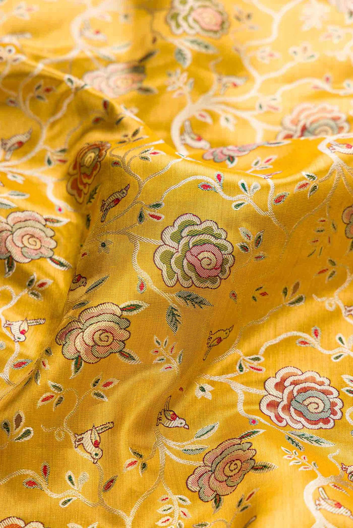 Close up of Mustard Dual Tone Kanchipuram Tissue Silk Saree with Zari Brocade on the body and Zari Border displaying folds