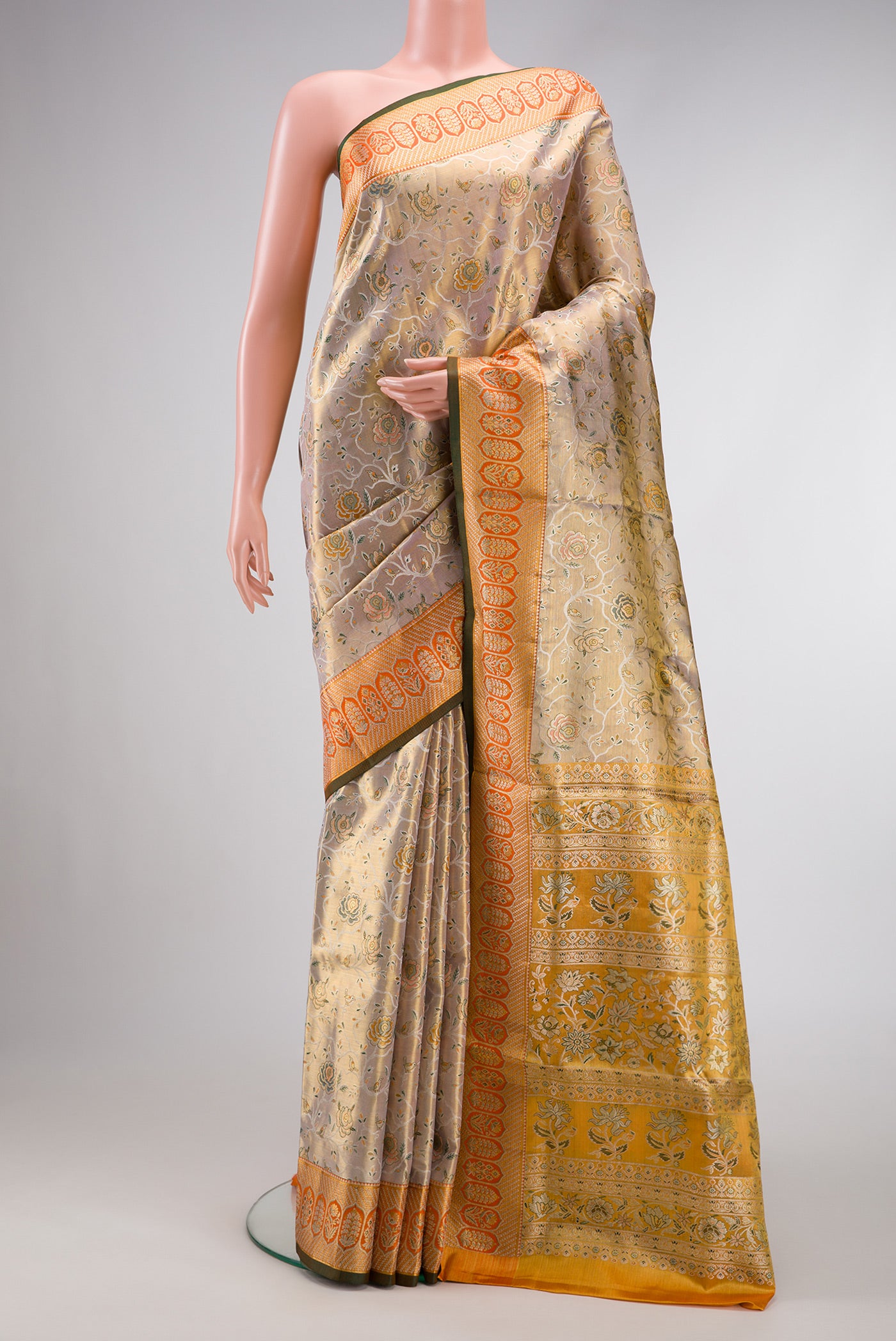 Gold Dual Tone Kanchipuram Tissue Silk Saree with Zari Brocade on the body and Zari Border.  displayed on a mannequin