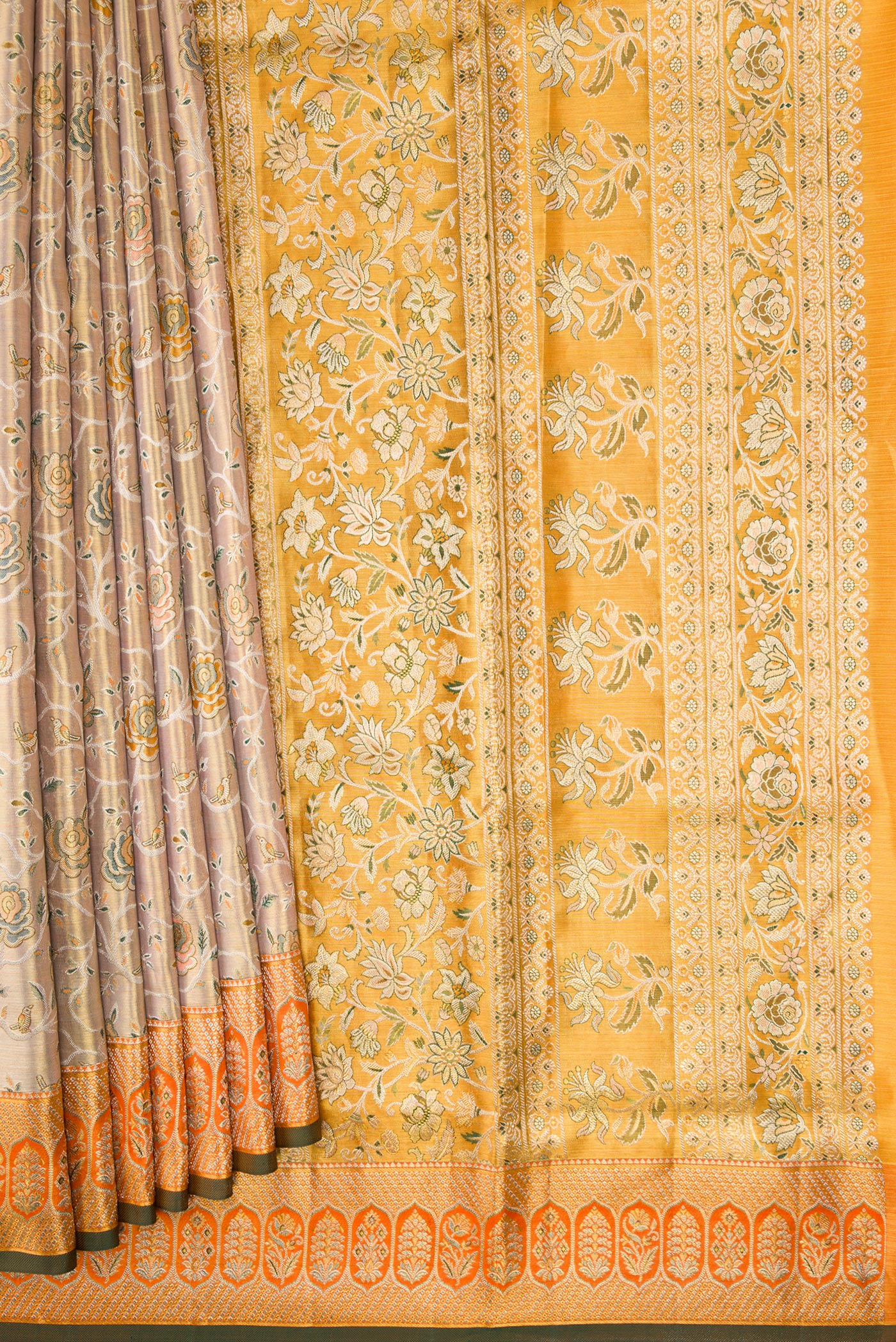 Pleats and pallu of Gold Dual Tone Kanchipuram Tissue Silk Saree with Zari Brocade on the body and Zari Border. 