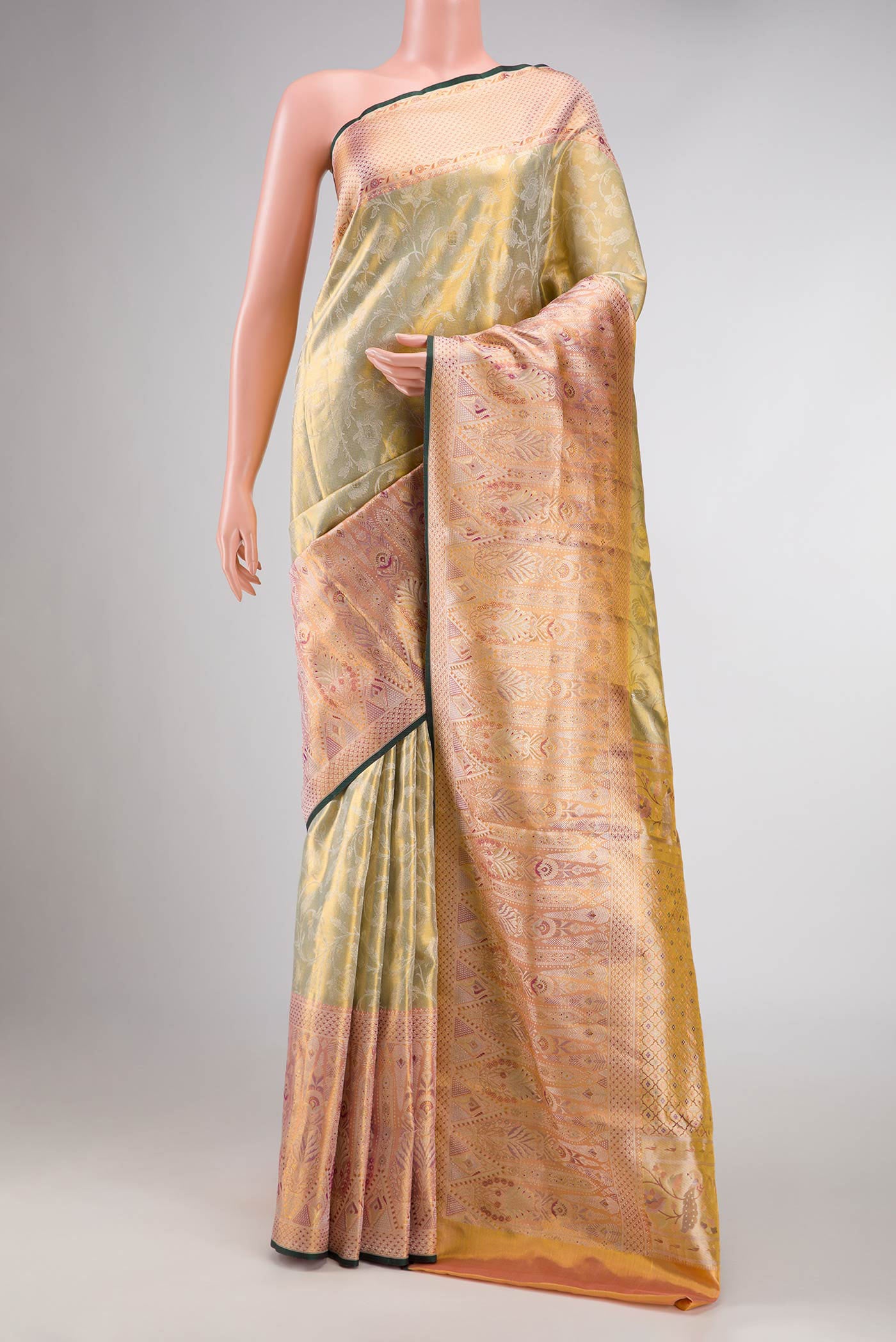 Light Green Dual Tone Kanchipuram Tissue Silk Saree with Zari Brocade on the body and Zari Border displayed on a mannequin