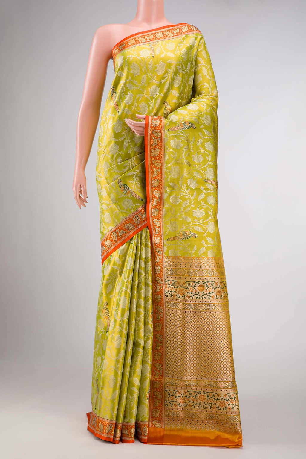 Parrot Green Dual Tone Kanchipuram Tissue Silk Saree with Zari Brocade on the body and Zari Border displayed on a mannequin