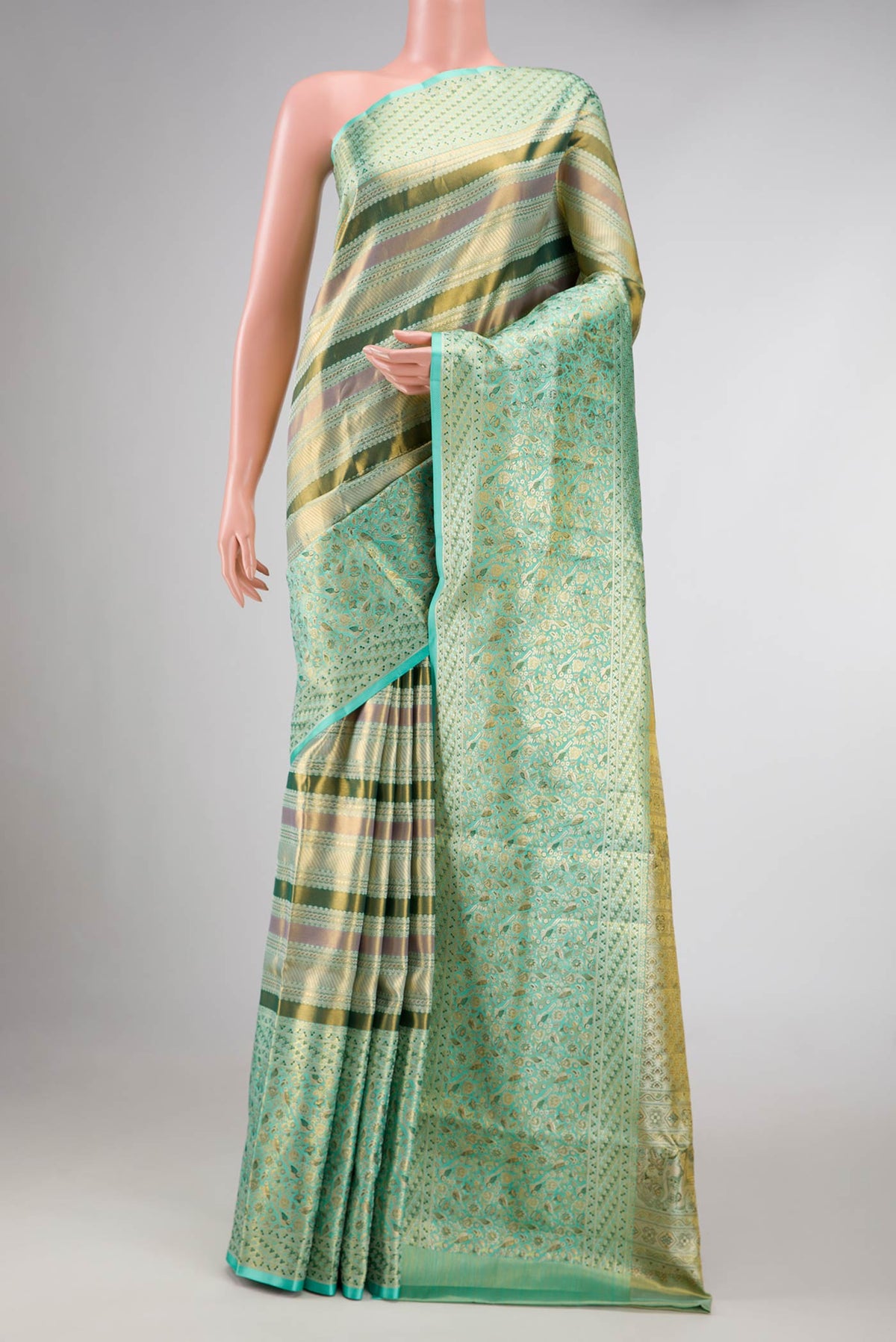 Green Dual Tone Kanchipuram Tissue Silk Saree with Zari Brocade on the body and Zari Border displayed on a mannequin