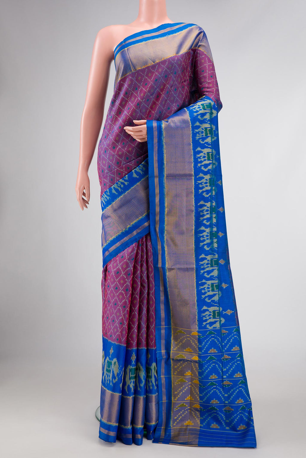 Purple Dual Tone Double Ikat Saree with Ikat Print on the body and Zari Border.  displayed on a mannequin