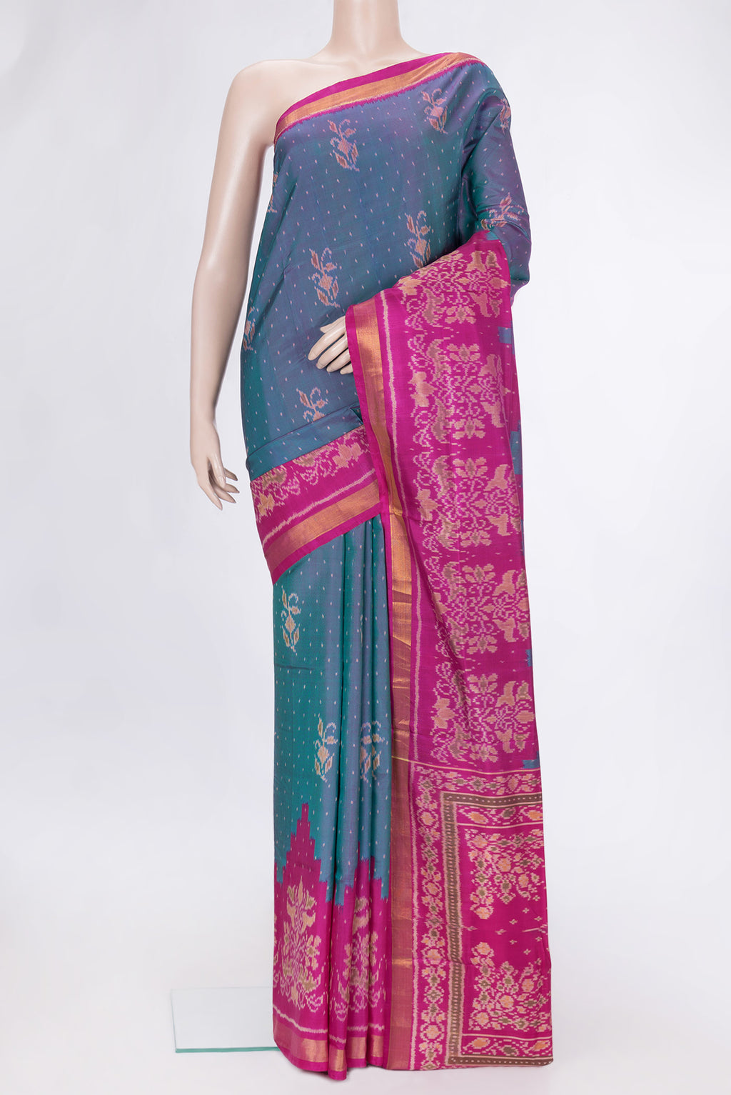 Peacock Blue Dual Tone Double Ikat Saree with Ikat Print on the body and Ikat Border.  displayed on a mannequin