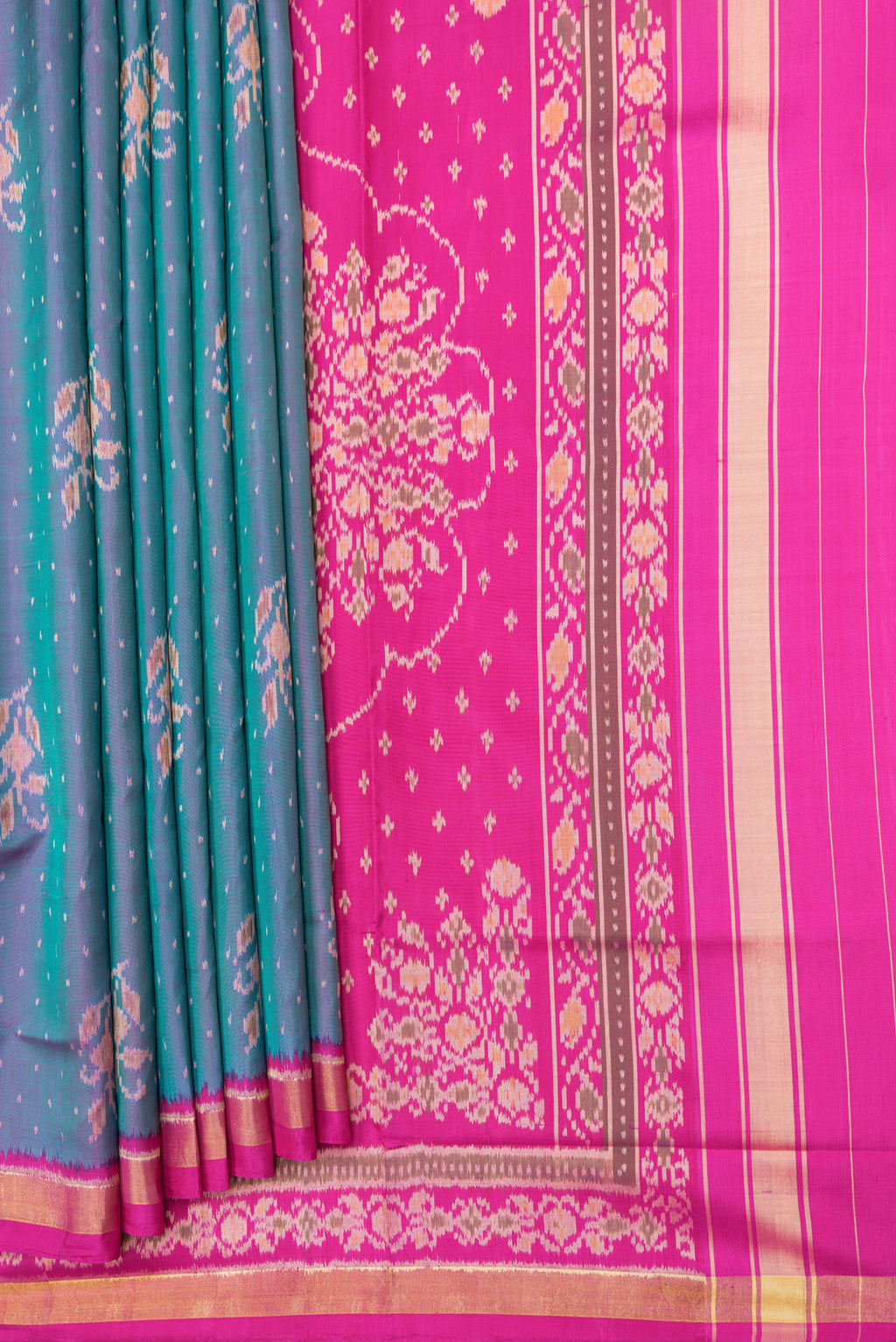 Pleats and pallu of Peacock Blue Dual Tone Double Ikat Saree with Ikat Print on the body and Ikat Border. 
