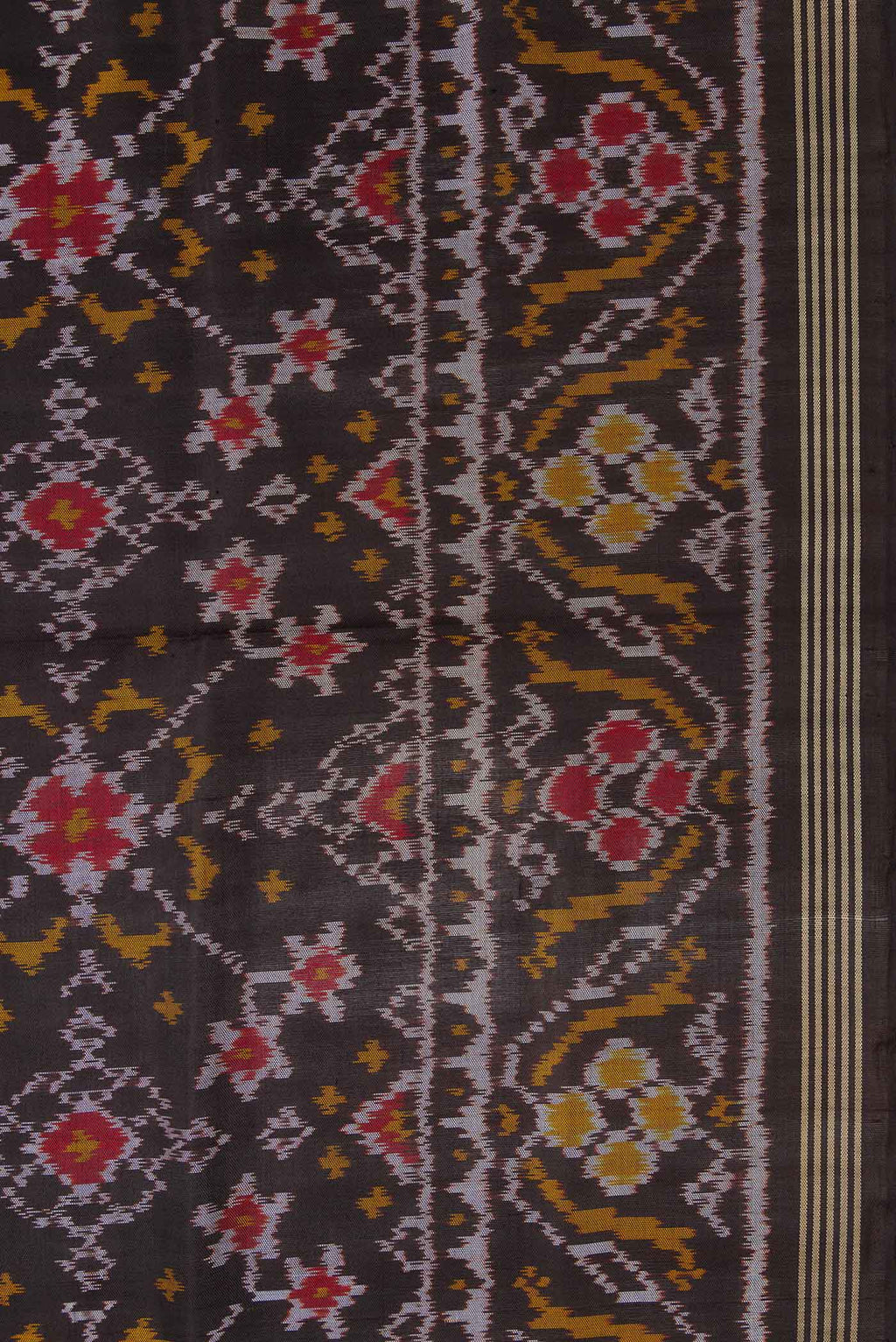 Border image of Black Dual Tone Rajkot Patola Silk Saree with Ikat Print on the body and Zari Border. 