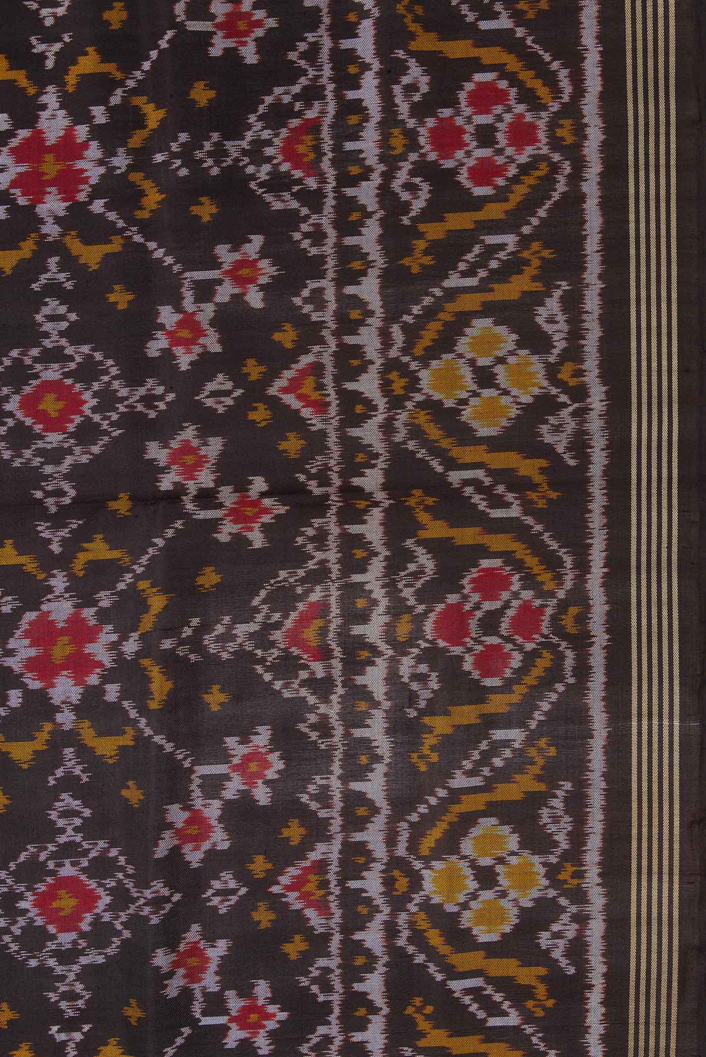 Border image of Black Dual Tone Rajkot Patola Silk Saree with Ikat Print on the body and Zari Border. 
