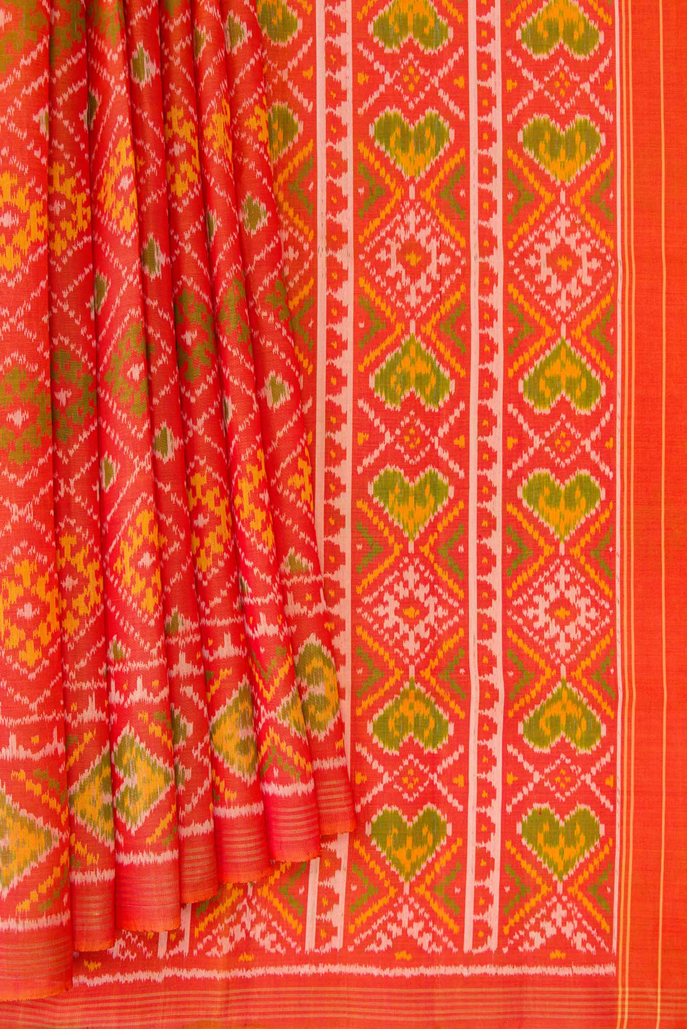 Pleats and pallu of Orange Dual Tone Rajkot Patola Silk Saree with Ikat Print on the body and Zari Border. 