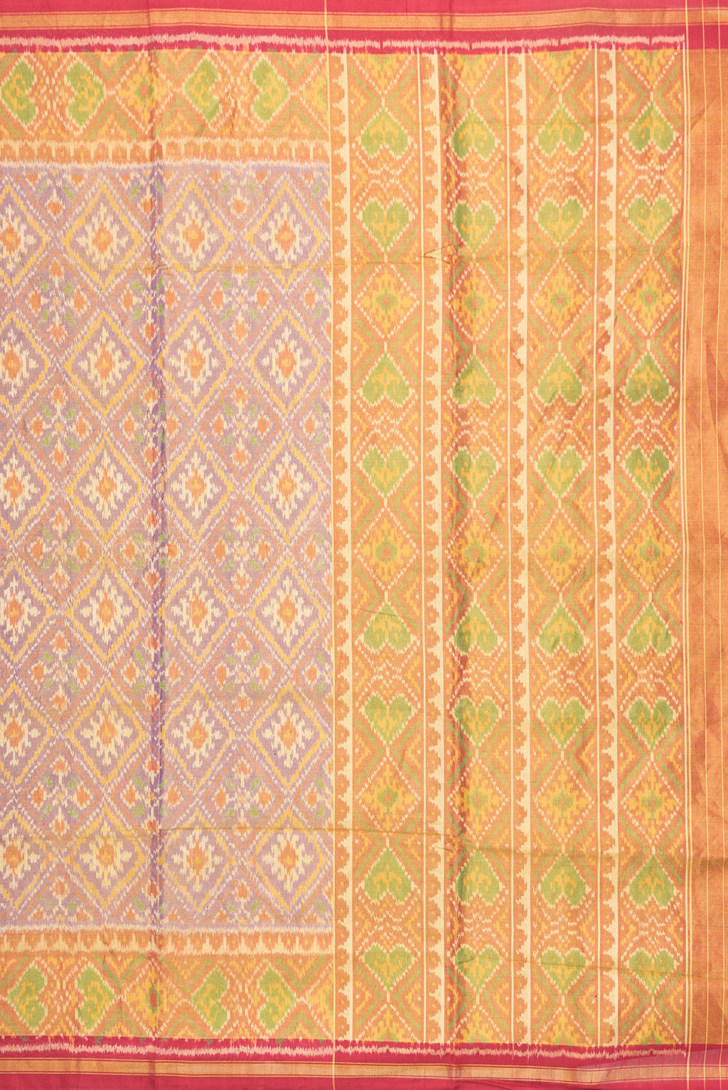 Close up image of the pallu of Lavender Dual Tone Double Ikat Saree with Ikat Print on the body and Zari Border. 
