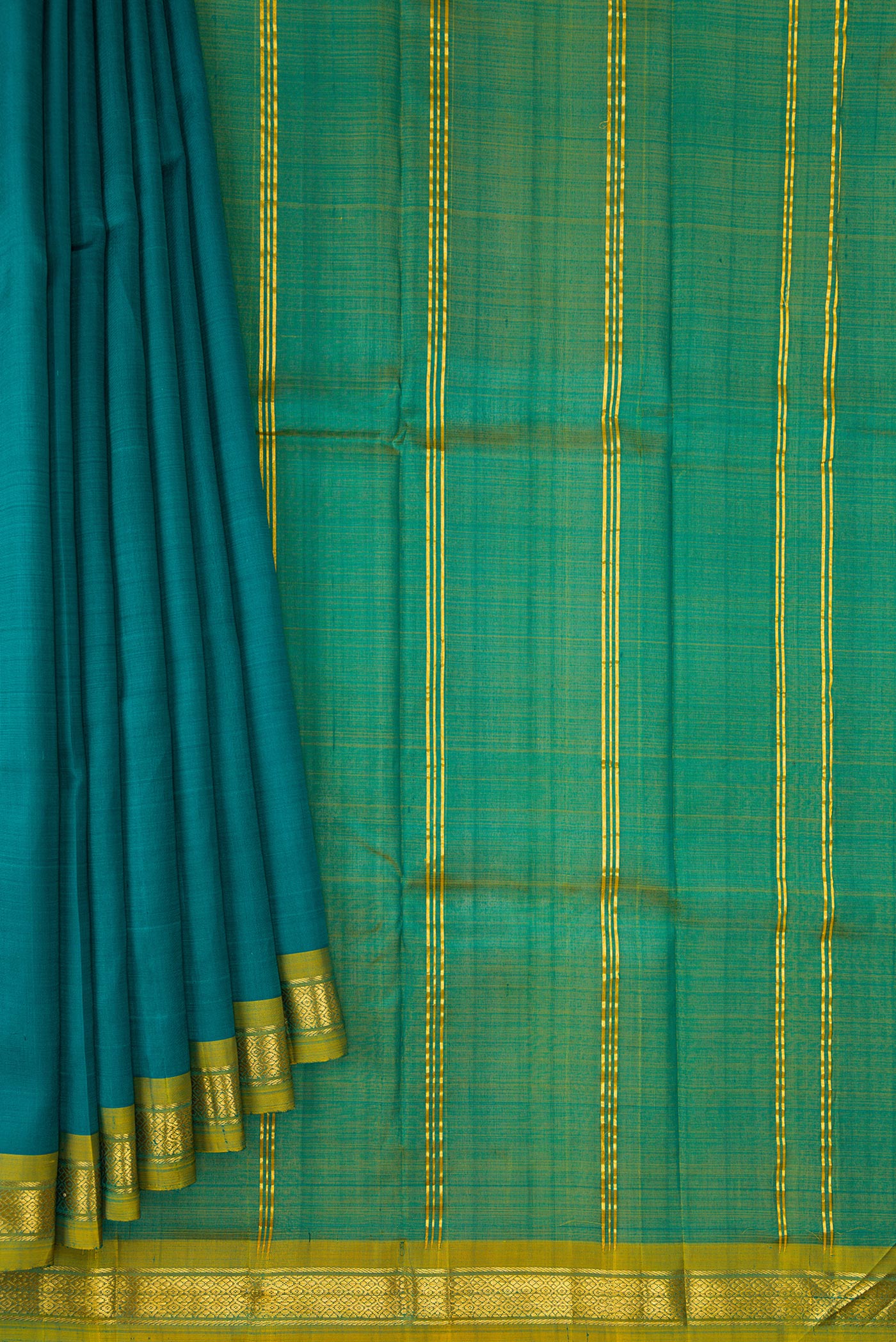 Pleats and pallu of Peacock Blue Dual Tone Kanchipuram Silk Saree with Plain Body and Zari Border. 
