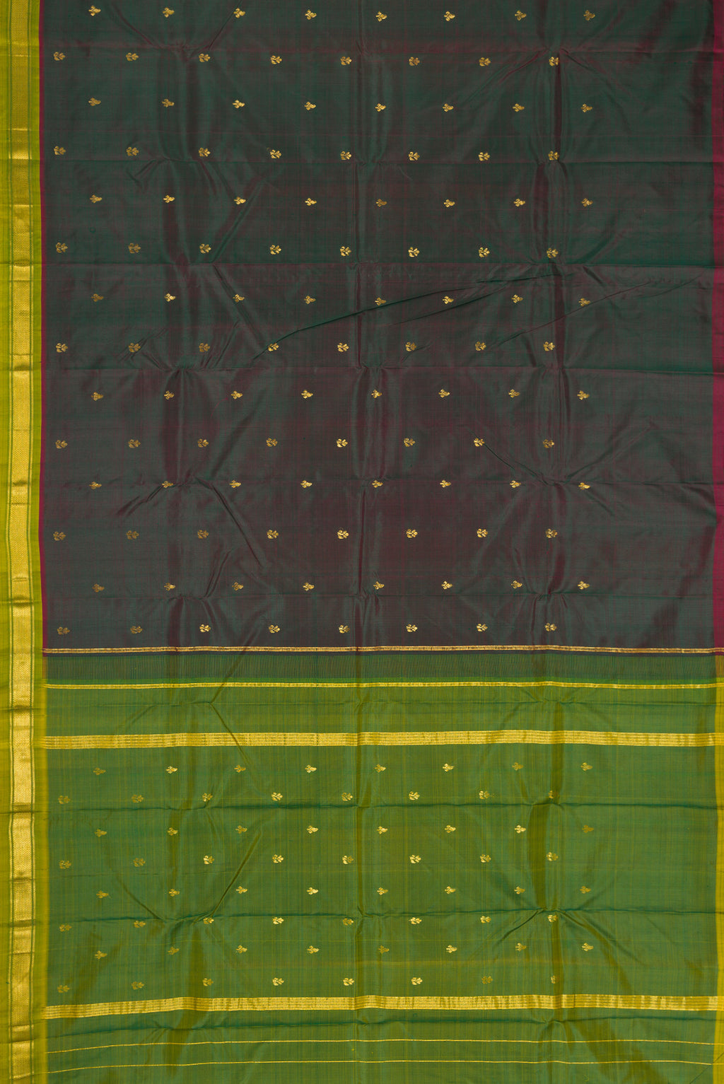 Bottle Green Dual Tone Kanchipuram Silk Saree with Zari Butta on the body and Zari Border.  displayed on a mannequin